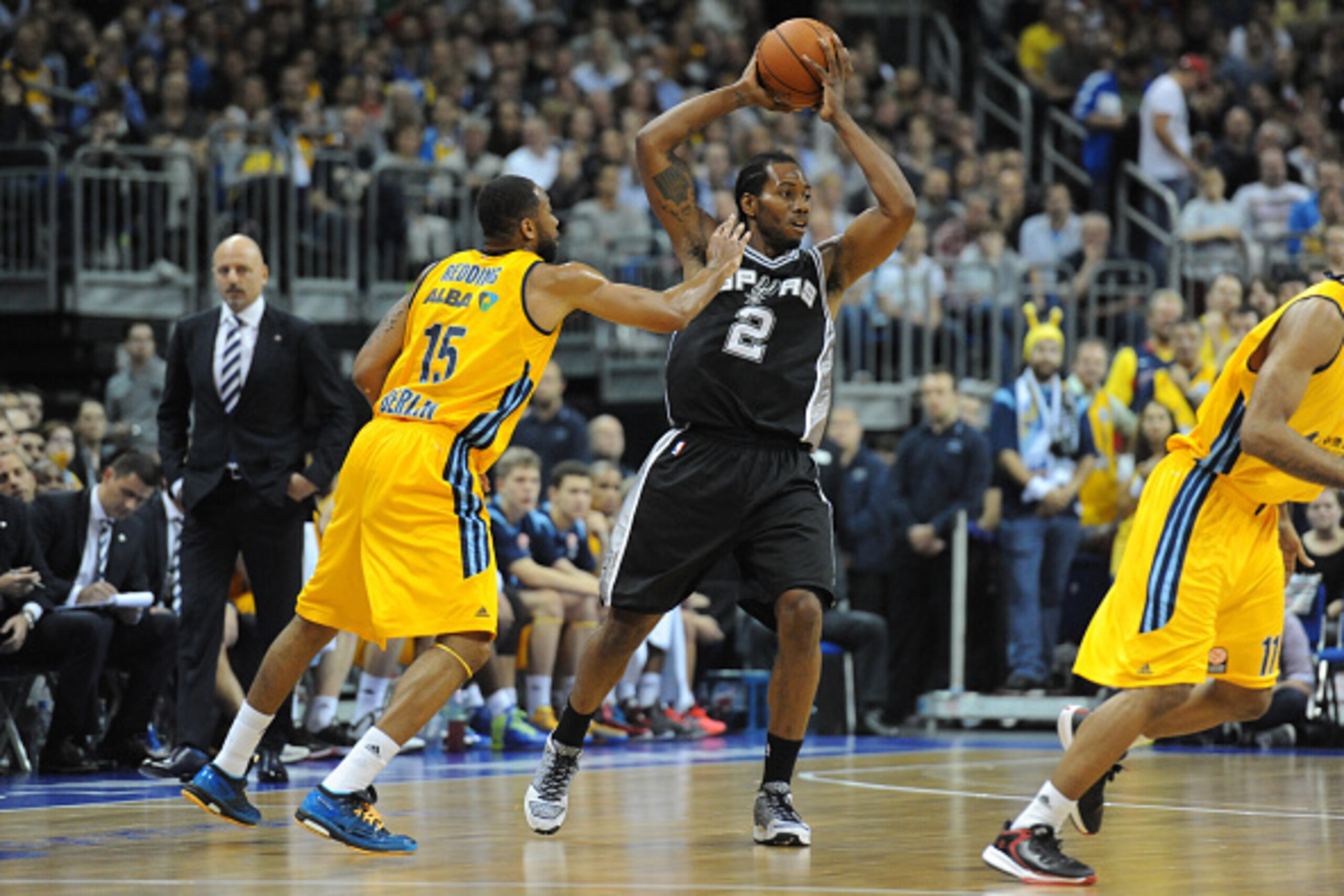 BERLIN - OCTOBER 8: Kawhi Leonard #2 of the San Antonio Spurs passes against Alber Berlin during a game as part of the 2014 Global Games on October 8, 2014 at the O2 Arena in Berlin, Germany. NOTE TO USER: User expressly acknowledges and agrees that, by d