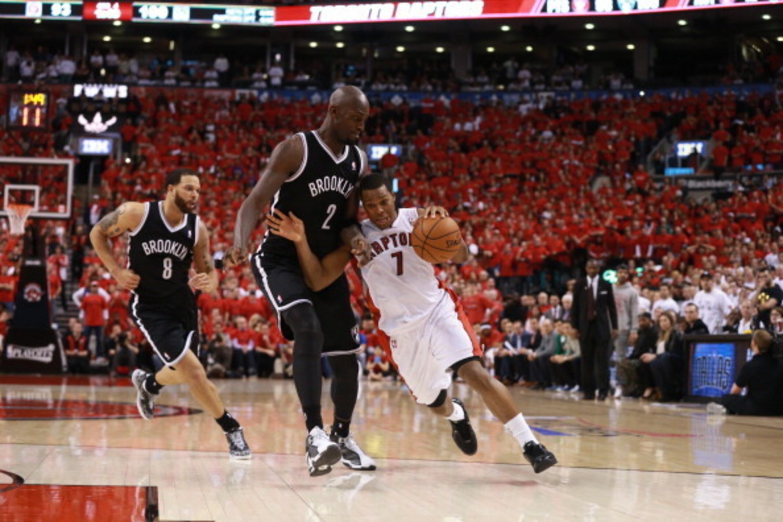 TORONTO,ON - MAY 4: Kyle Lowry #7 of the Toronto Raptors drives to the basket during Game seven of the Quarterfinal NBA Eastern Conference playoff game against Kevin Garnett #2 of the Brooklyn Nets at the Air Canada Centre on May 4, 2014 in Toronto, Ontar