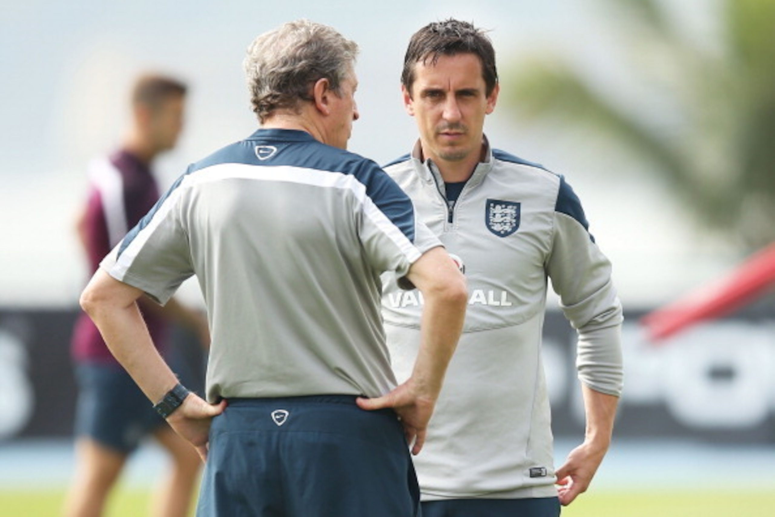 RIO DE JANEIRO, BRAZIL - JUNE 21:  England head coach Roy Hodgson speaks with assistant coach Gary Neville during a training session at the Urca military base (Forte de Urca) on June 21, 2014 in Rio de Janeiro, Brazil.  (Photo by Richard Heathcote/Getty I