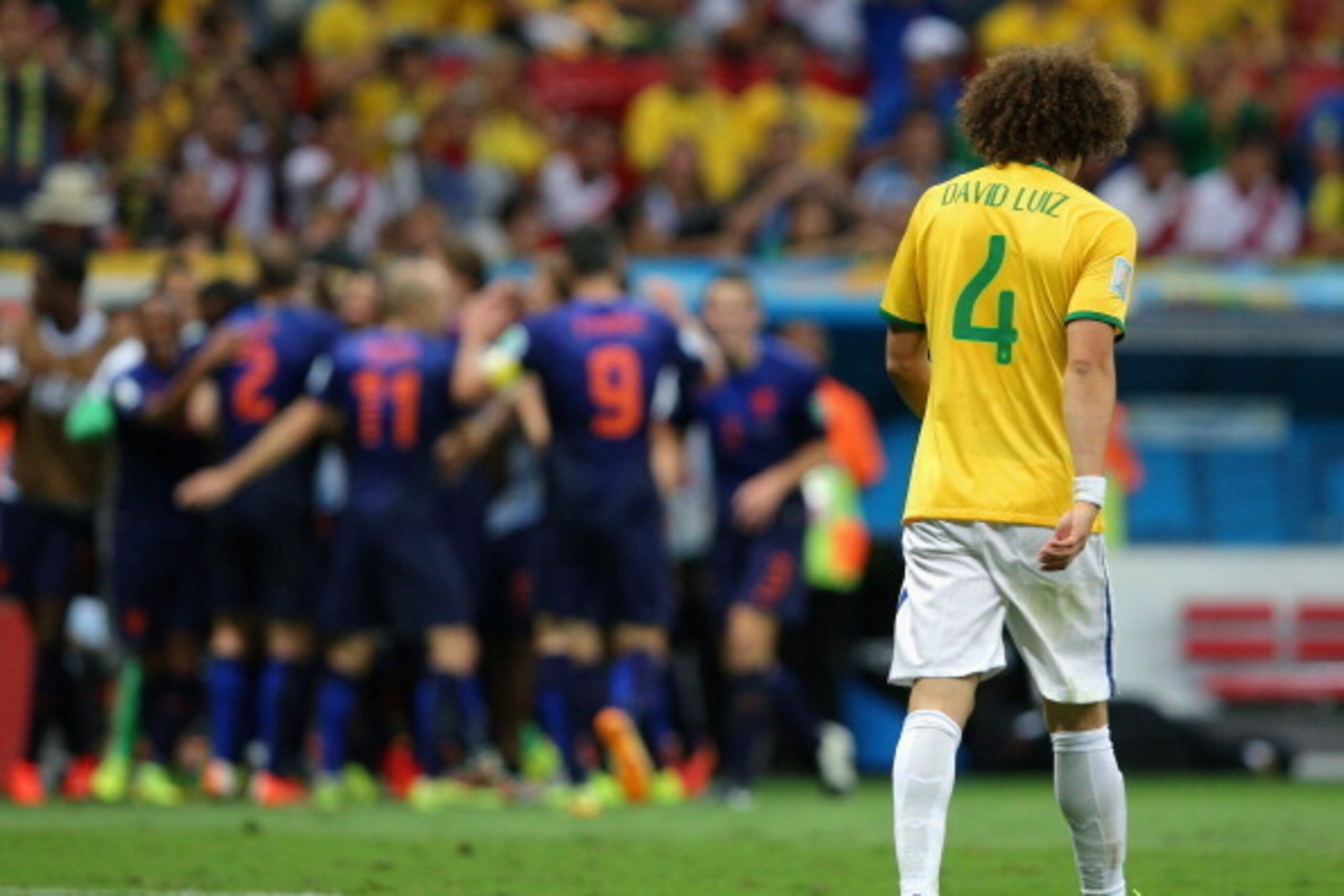 BRASILIA, BRAZIL - JULY 12:  A dejected David Luiz of Brazil walks off the pitch after a 3-0 defeat to the Netherlands during the 2014 FIFA World Cup Brazil Third Place Playoff match between Brazil and the Netherlands at Estadio Nacional on July 12, 2014 