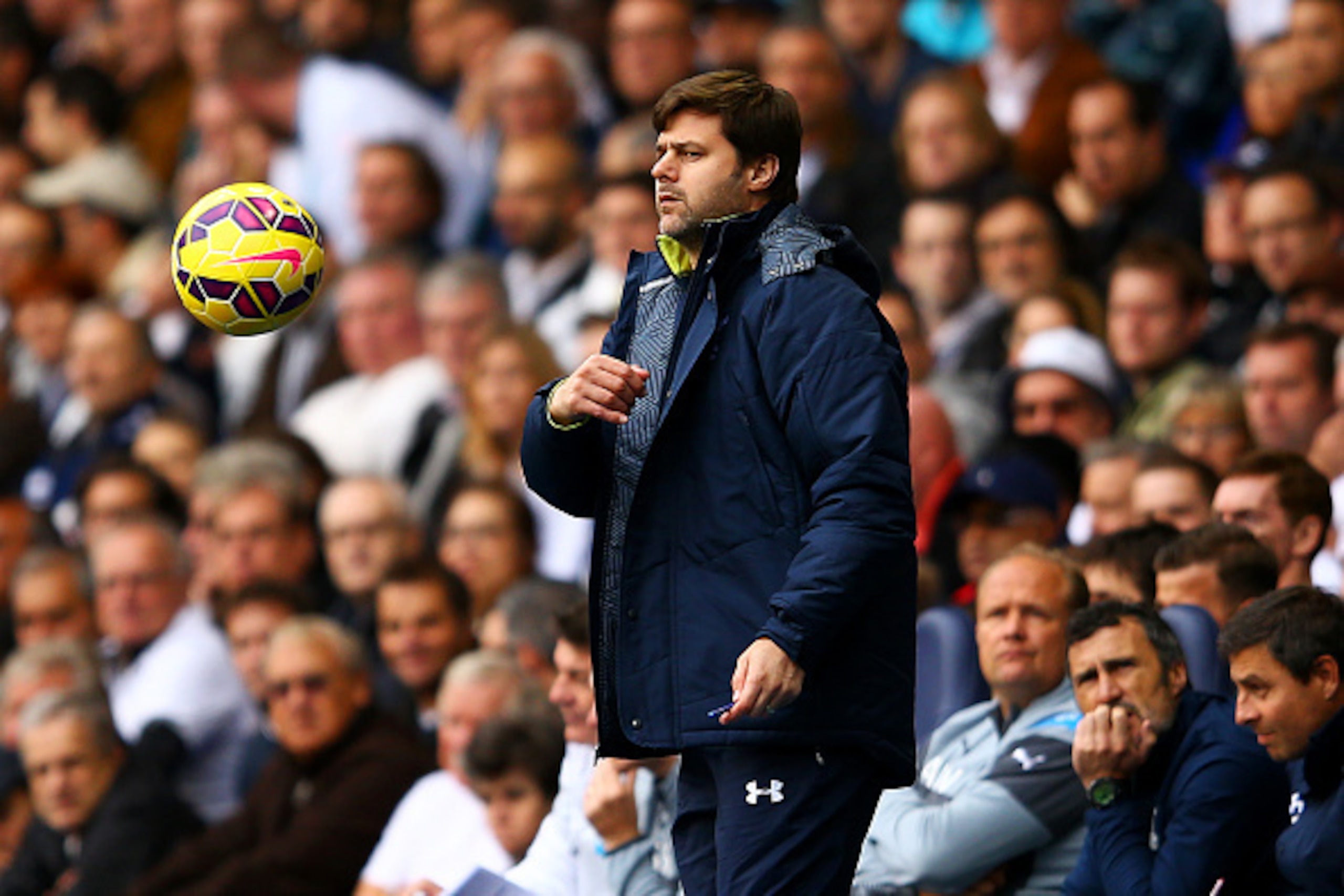 LONDON, ENGLAND - OCTOBER 26:  Mauricio Pochettino, manager of Spurs throws the ball during the Barclays Premier League match between Tottenham Hotspur and Newcastle United at White Hart Lane on October 26, 2014 in London, England.  (Photo by Richard Heat