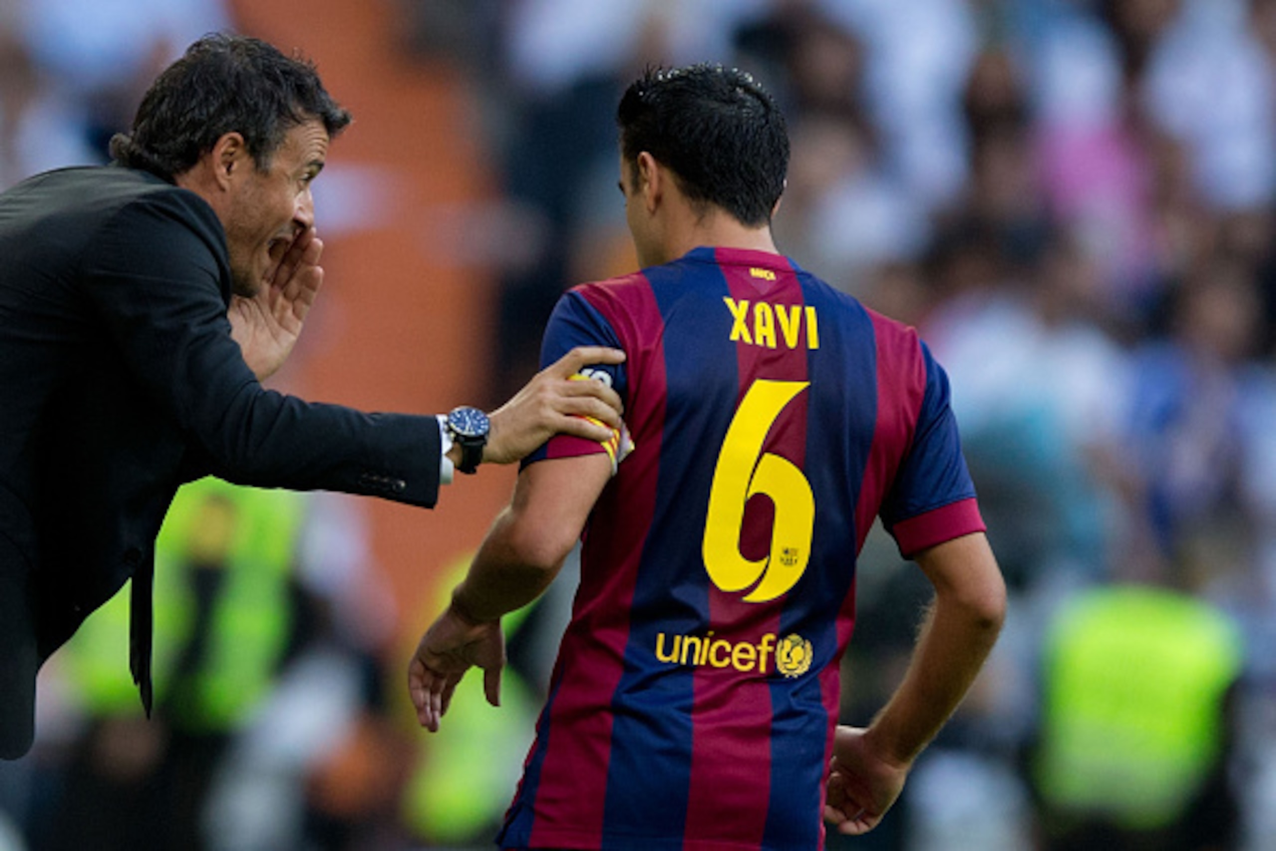 MADRID, SPAIN - OCTOBER 25: Head coach Luis Enrique Martinez (L) of FC Barcelona gives instructions to his player Xavi Hernandez (R) during the La Liga match between Real Madrid CF and FC Barcelona at Estadio Santiago Bernabeu on October 25, 2014 in Madri MADRID, SPAIN - OCTOBER 25: Head coach Luis Enrique Martinez (L) of FC Barcelona gives instructions to his player Xavi Hernandez (R) during the La Liga match between Real Madrid CF and FC Barcelona at Estadio Santiago Bernabeu on October 25, 2014 in Madri