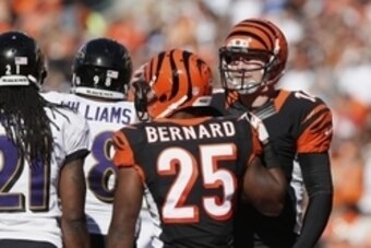 Oct 26, 2014; Cincinnati, OH, USA; Cincinnati Bengals running back Giovani Bernard (25) celebrates his touchdown with quarterback Andy Dalton (14) during the second half against the Baltimore Ravens at Paul Brown Stadium. The Bengals won 27-24. Mandatory
