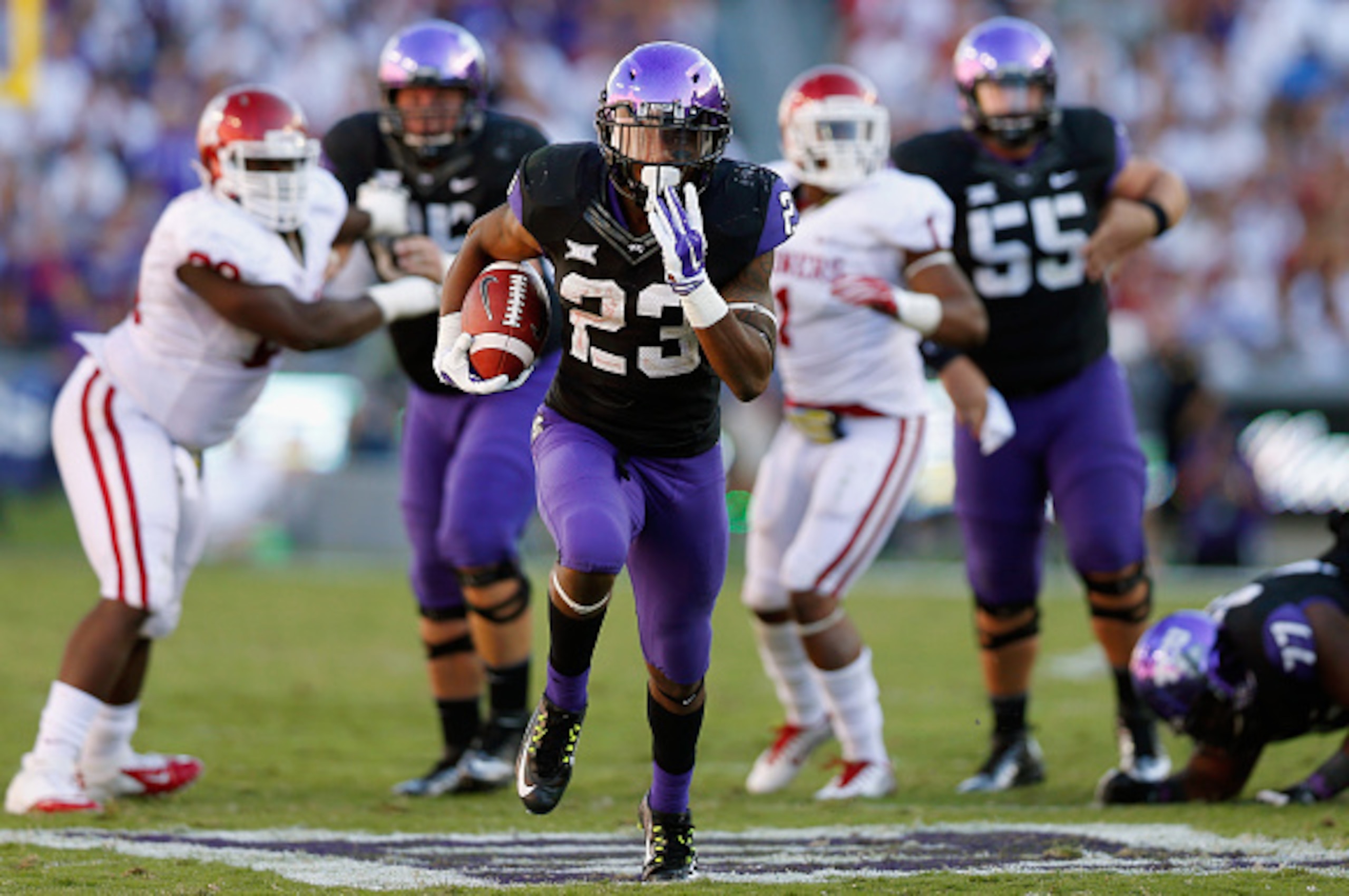 FORT WORTH, TX - OCTOBER 04:  Running back B.J. Catalon #23 of the TCU Horned Frogs carries the ball against the Oklahoma Sooners in the second half at Amon G. Carter Stadium on October 4, 2014 in Fort Worth, Texas.  (Photo by Tom Pennington/Getty Images)
