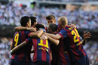 MADRID, SPAIN - OCTOBER 25:  Naymar of FC Barcelona celebrates with teammates after scoring his team's opening goal during the La Liga match between Real Madrid CF and FC Barcelona at Estadio Santiago Bernabeu on October 25, 2014 in Madrid, Spain.  (Photo