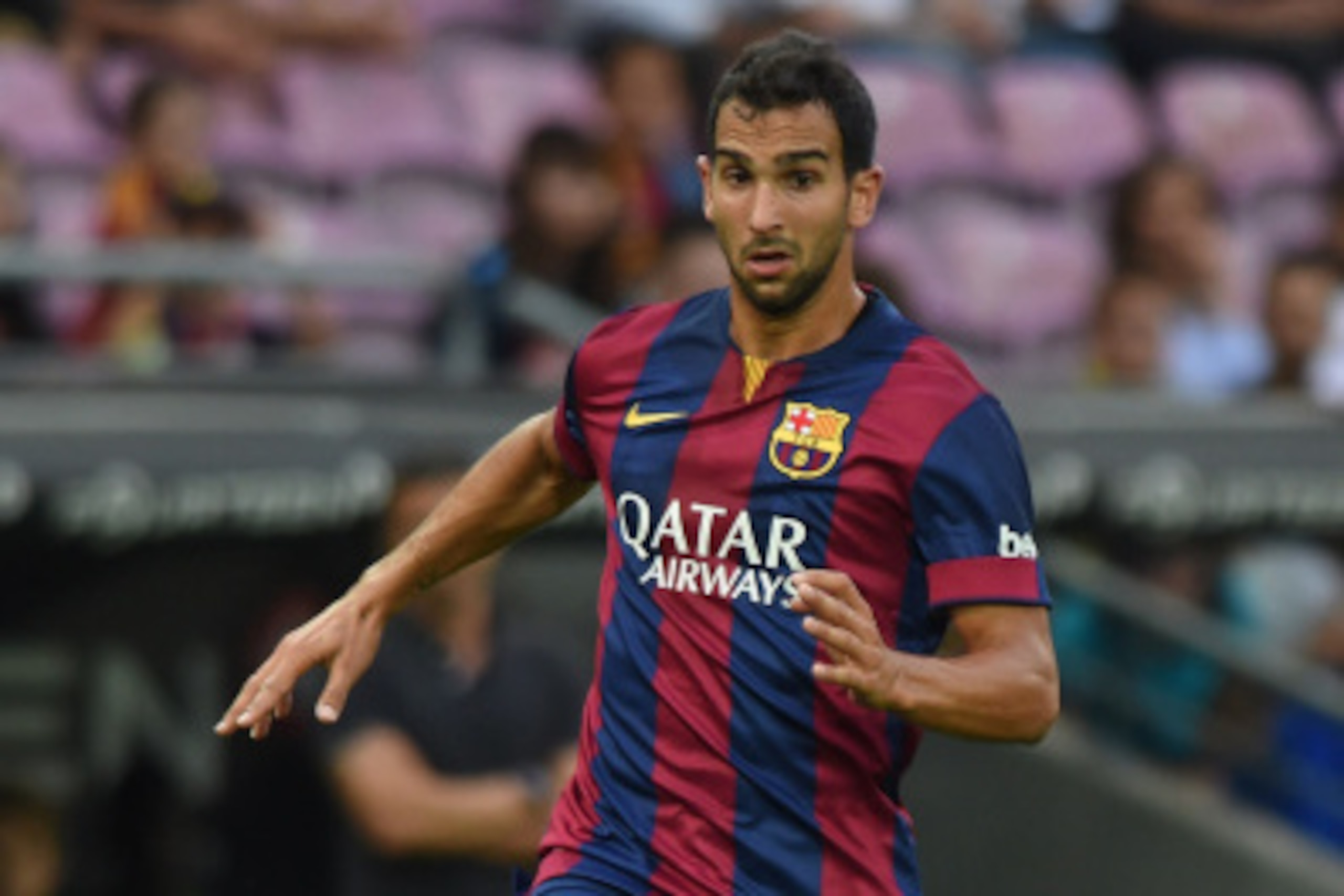 GENEVA, SWITZERLAND - AUGUST 06:  Martin Montoya of FC Barcelona in action during the pre-season friendly match between FC Barcelona and SSC Napoli on August 6, 2014 in Geneva, Switzerland.  (Photo by Valerio Pennicino/Getty Images)