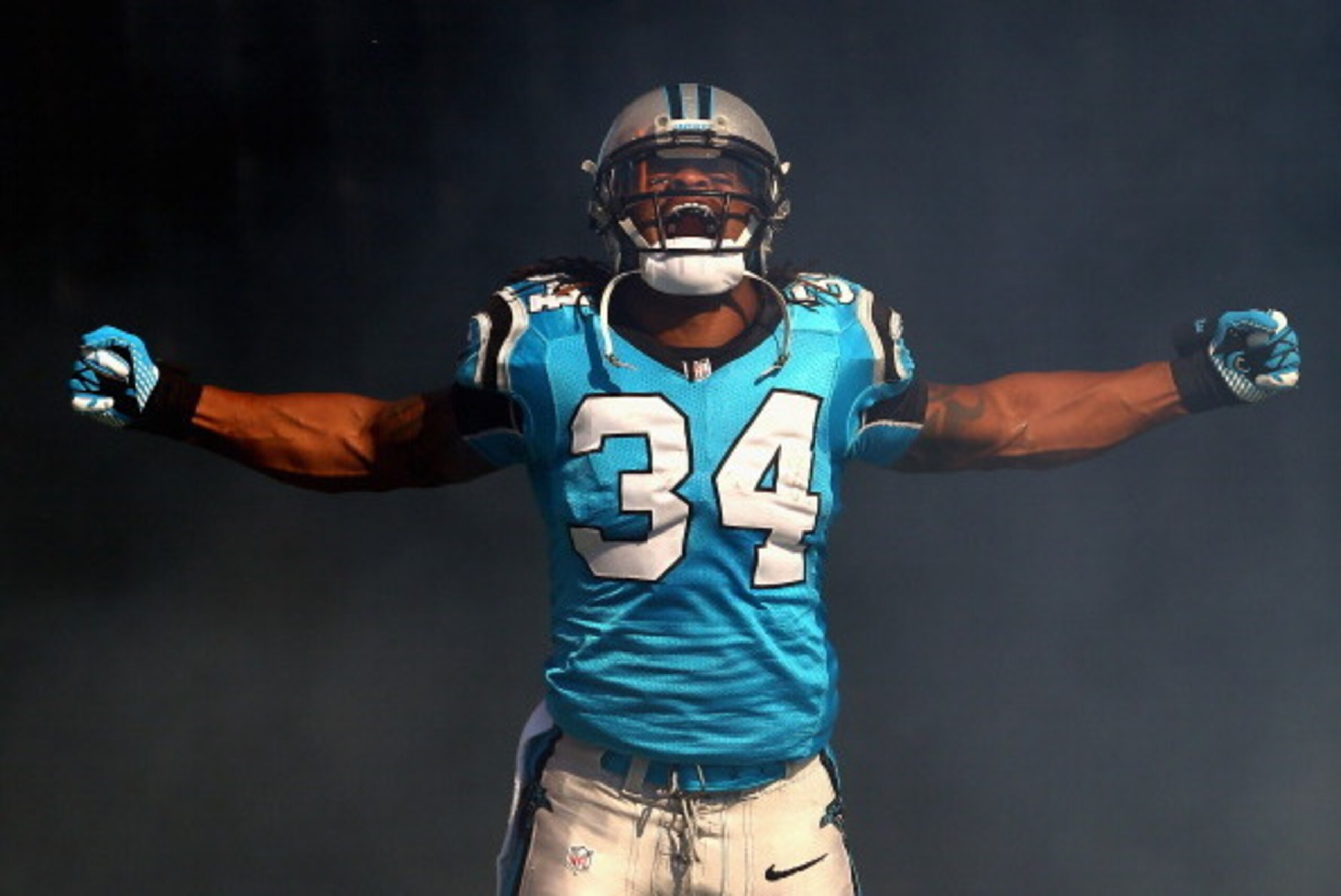 CHARLOTTE, NC - NOVEMBER 03:   DeAngelo Williams #34 of the Carolina Panthers is introduced before their game against the Atlanta Falcons at Bank of America Stadium on November 3, 2013 in Charlotte, North Carolina.  (Photo by Streeter Lecka/Getty Images)