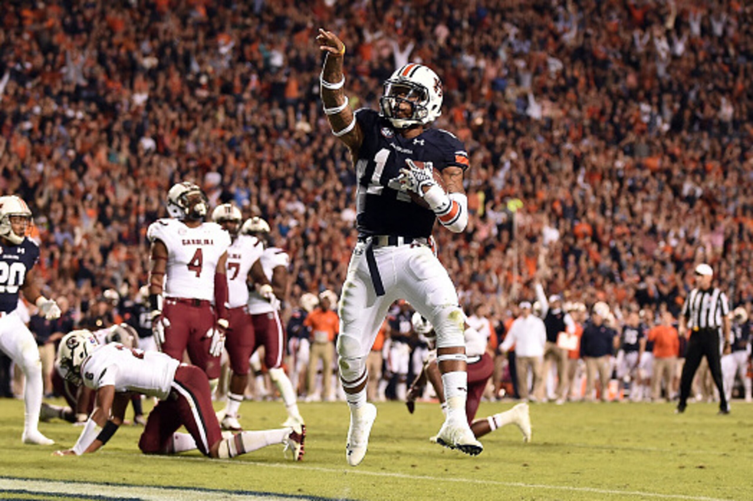 AUBURN, AL - OCTOBER 25:  Nick Marshall #14 of the Auburn Tigers scores a touchdown during the fourth quarter of a game against the South Carolina Gamecocks at Jordan Hare Stadium on October 25, 2014 in Auburn, Alabama.  (Photo by Stacy Revere/Getty Image