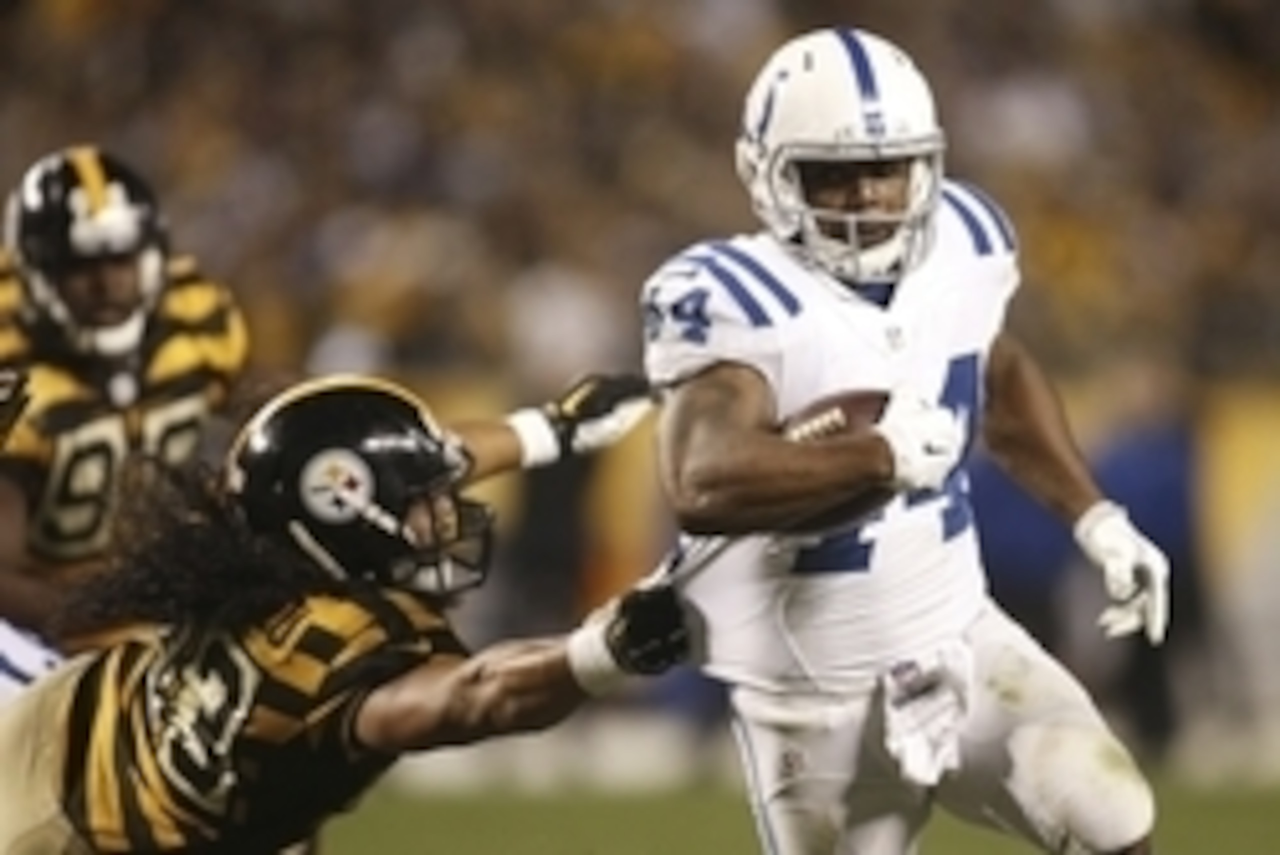 Oct 26, 2014; Pittsburgh, PA, USA; Indianapolis Colts running back Ahmad Bradshaw (44) scores on a twelve yard touchdown run past Pittsburgh Steelers strong safety Troy Polamalu (43) during the third quarter at Heinz Field. The Steelers won 51-34. Mandato