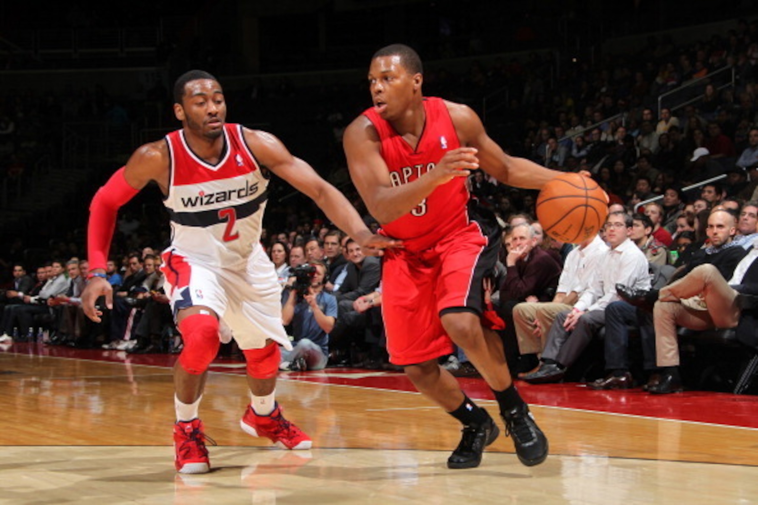 WASHINGTON, DC - FEBRUARY 19: Kyle Lowry #3 of the Toronto Raptors drives against John Wall #2 of the Washington Wizards during the game at the Verizon Center on February 19, 2013 in Washington, DC. NOTE TO USER: User expressly acknowledges and agrees tha