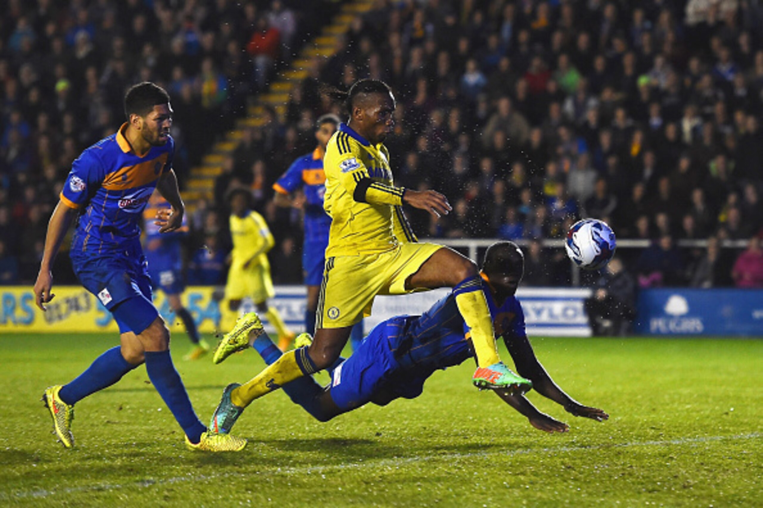 SHREWSBURY, ENGLAND - OCTOBER 28:  Didier Drogba of Chelsea shoots towards goal during the Capital One Cup Fourth Round match between Shrewsbury Town and Chelsea at Greenhous Meadow on October 28, 2014 in Shrewsbury, England.  (Photo by Laurence Griffiths