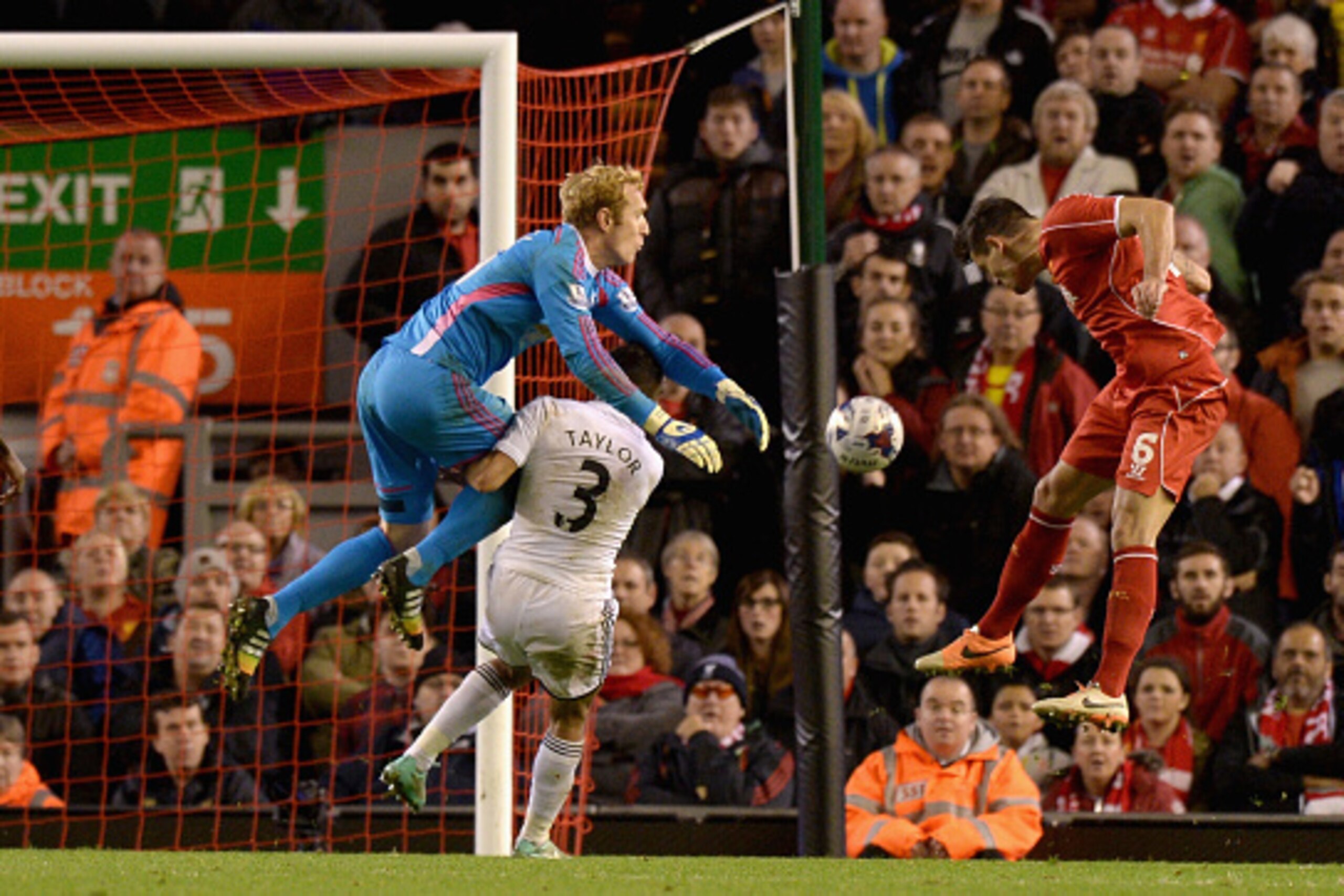 LIVERPOOL, ENGLAND - OCTOBER 28:  Dejan Lovren of Liverpool scores the winning goal past Gerhard Tremmel of Swansea during the Capital One Cup Fourth Round match between Liverpool and Swansea City at Anfield on October 28, 2014 in Liverpool, England.  (Ph