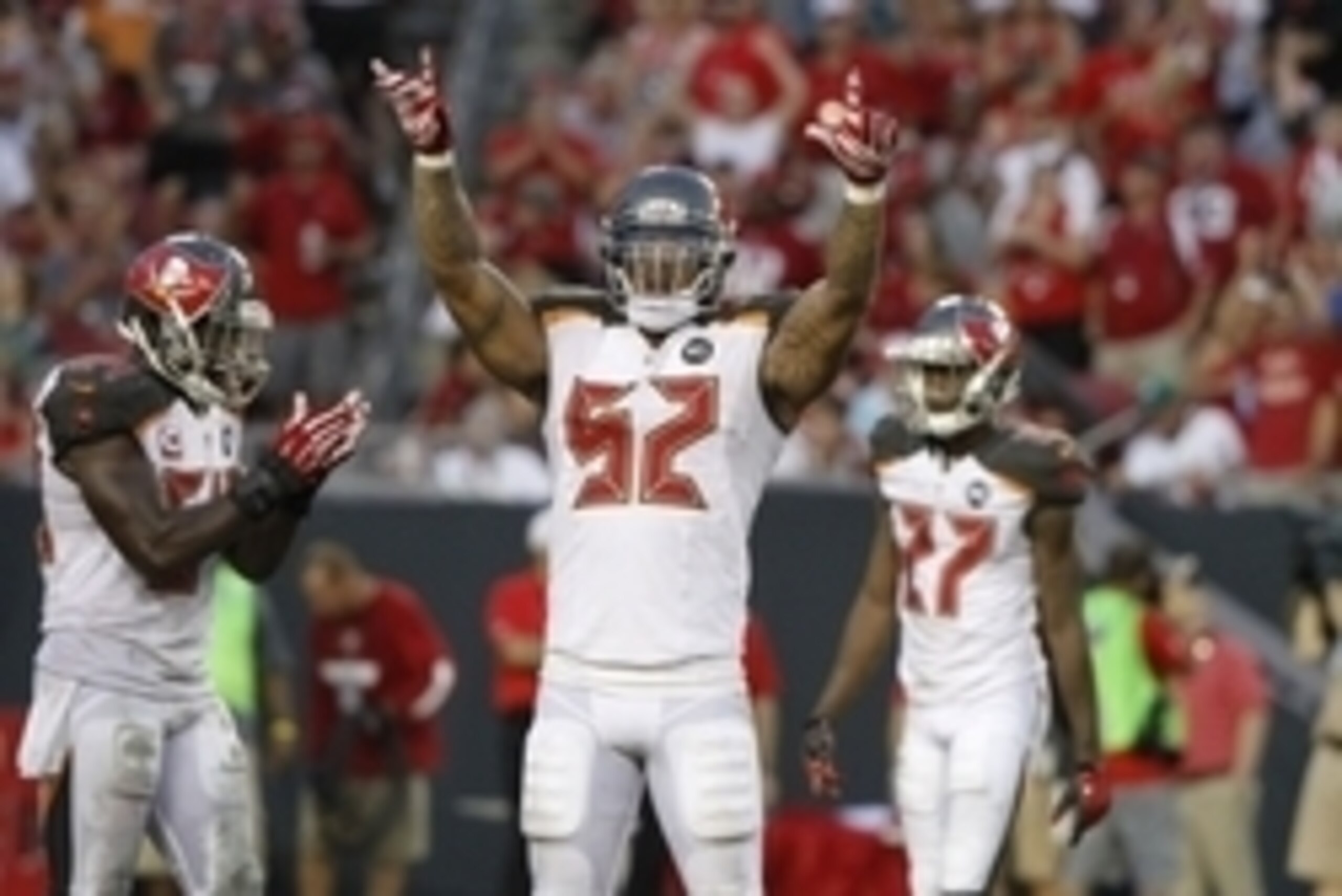Sep 14, 2014; Tampa, FL, USA; Tampa Bay Buccaneers outside linebacker Jonathan Casillas (52) gets the crowd pumped up during the second half against the Tampa Bay Buccaneers at Raymond James Stadium. St. Louis Rams defeated the Tampa Bay Buccaneers 19-17.