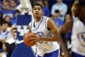 Oct 27, 2014; Lexington, KY, USA; Kentucky Wildcats forward Karl-Anthony Towns (12) passes the ball during the Blue-White Scrimmage at Rupp Arena. Mandatory Credit: Mark Zerof-USA TODAY Sports