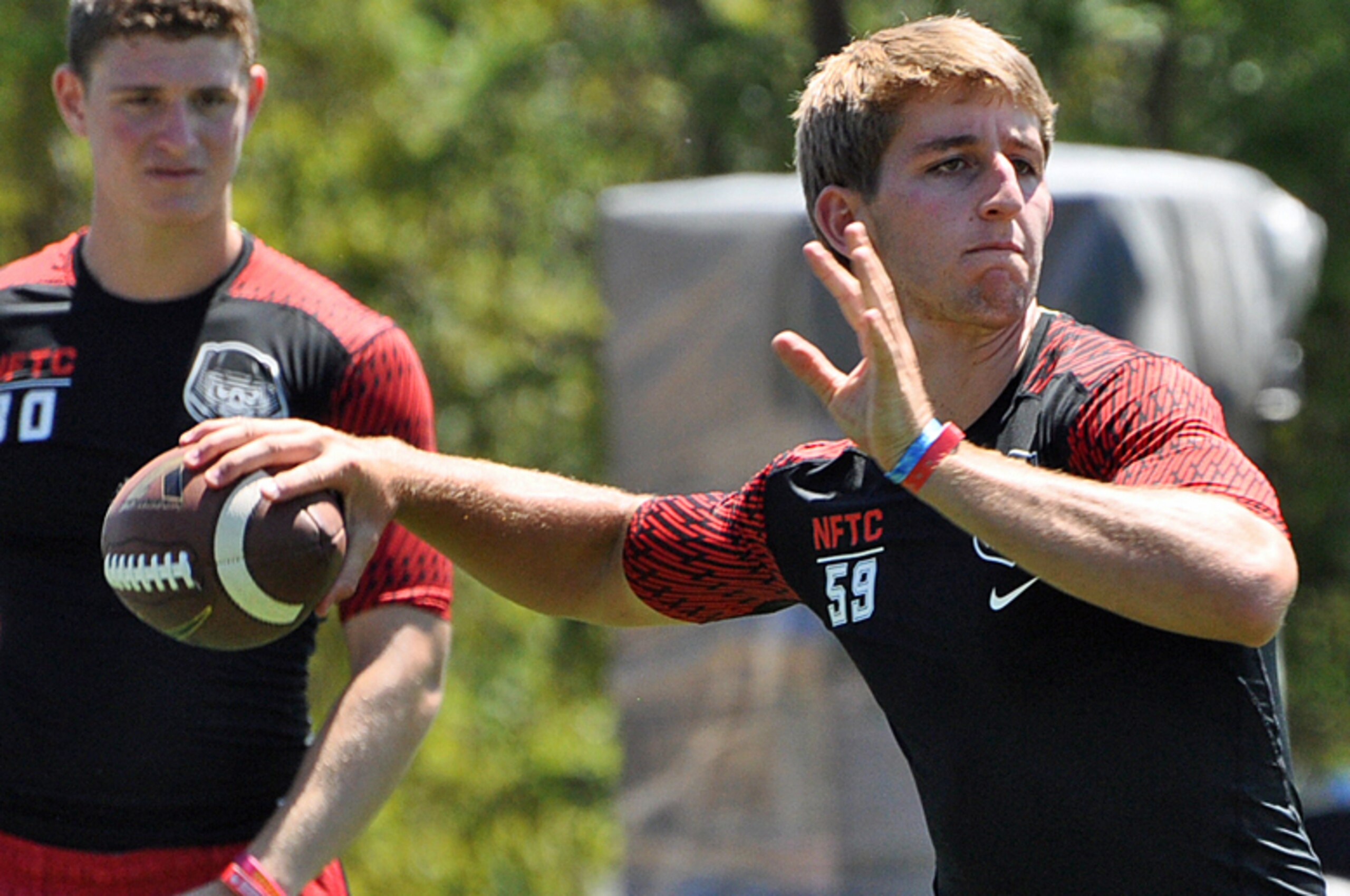 Rosen throws a pass as Town watches.