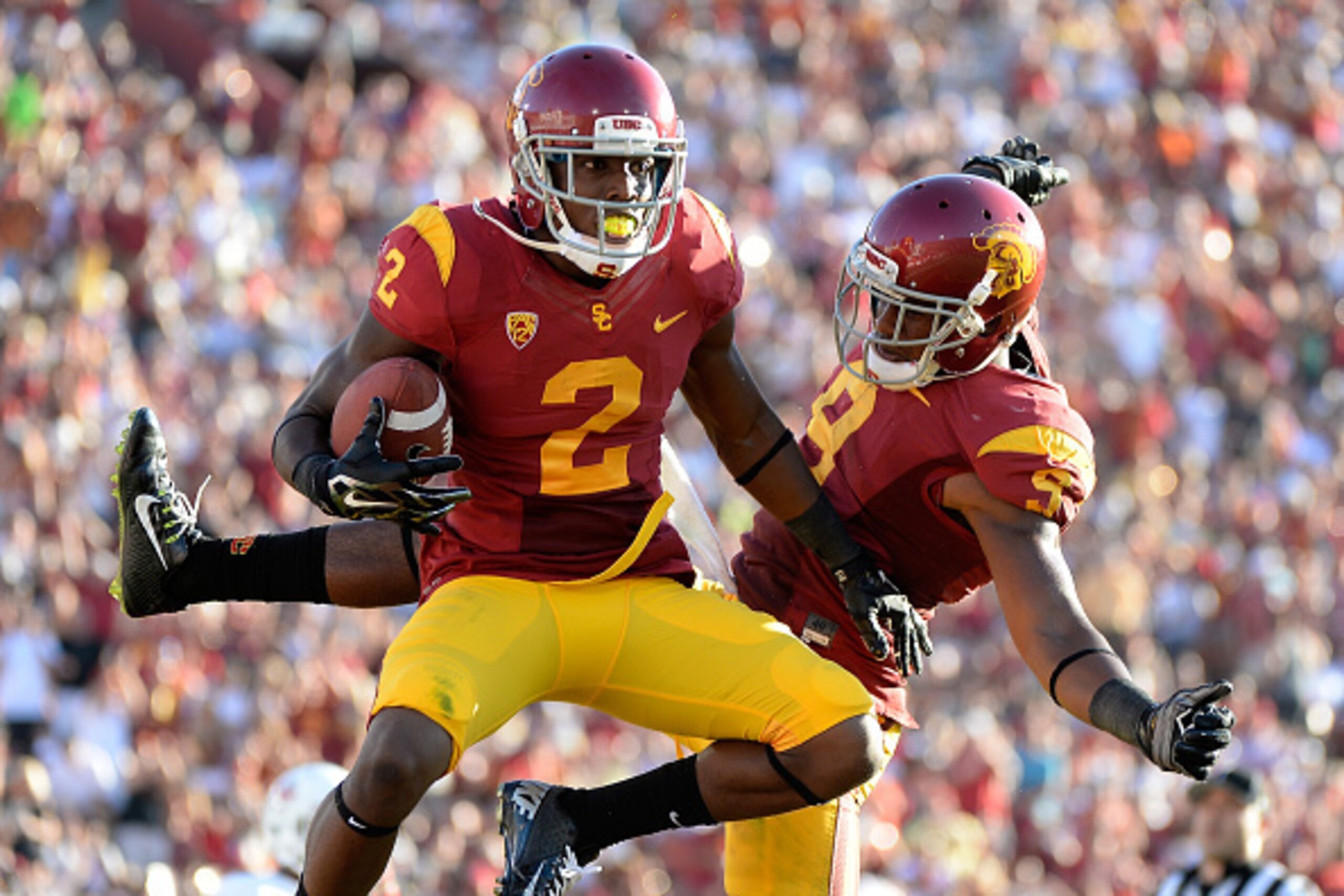 LOS ANGELES, CA - AUGUST 30:  Adoree' Jackson #2 of the USC Trojans celebrates his touchdwon with JuJu Smith #9 to take a 31-7 lead over the Fresno State Bulldogs during the second quarter at Los Angeles Memorial Coliseum on August 30, 2014 in Los Angeles
