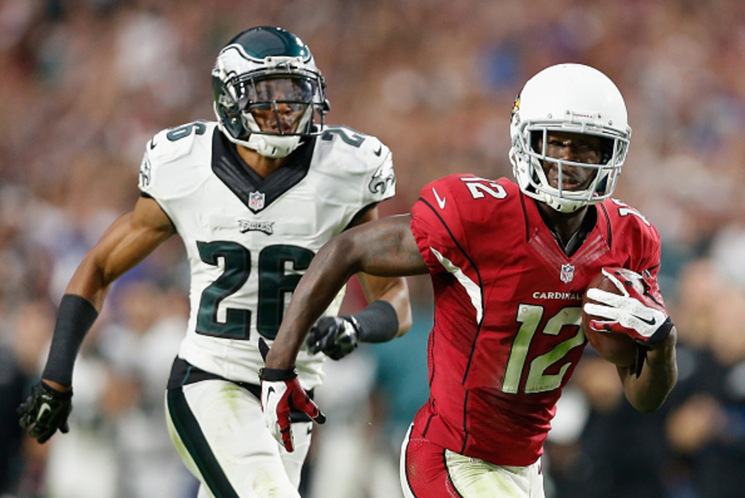 GLENDALE, AZ - OCTOBER 26:  Wide receiver John Brown #12 of the Arizona Cardinals runs with the football en route to score a 75 yard touchdown reception past cornerback Cary Williams #26 of the Philadelphia Eagles during NFL game at the University of Phoe