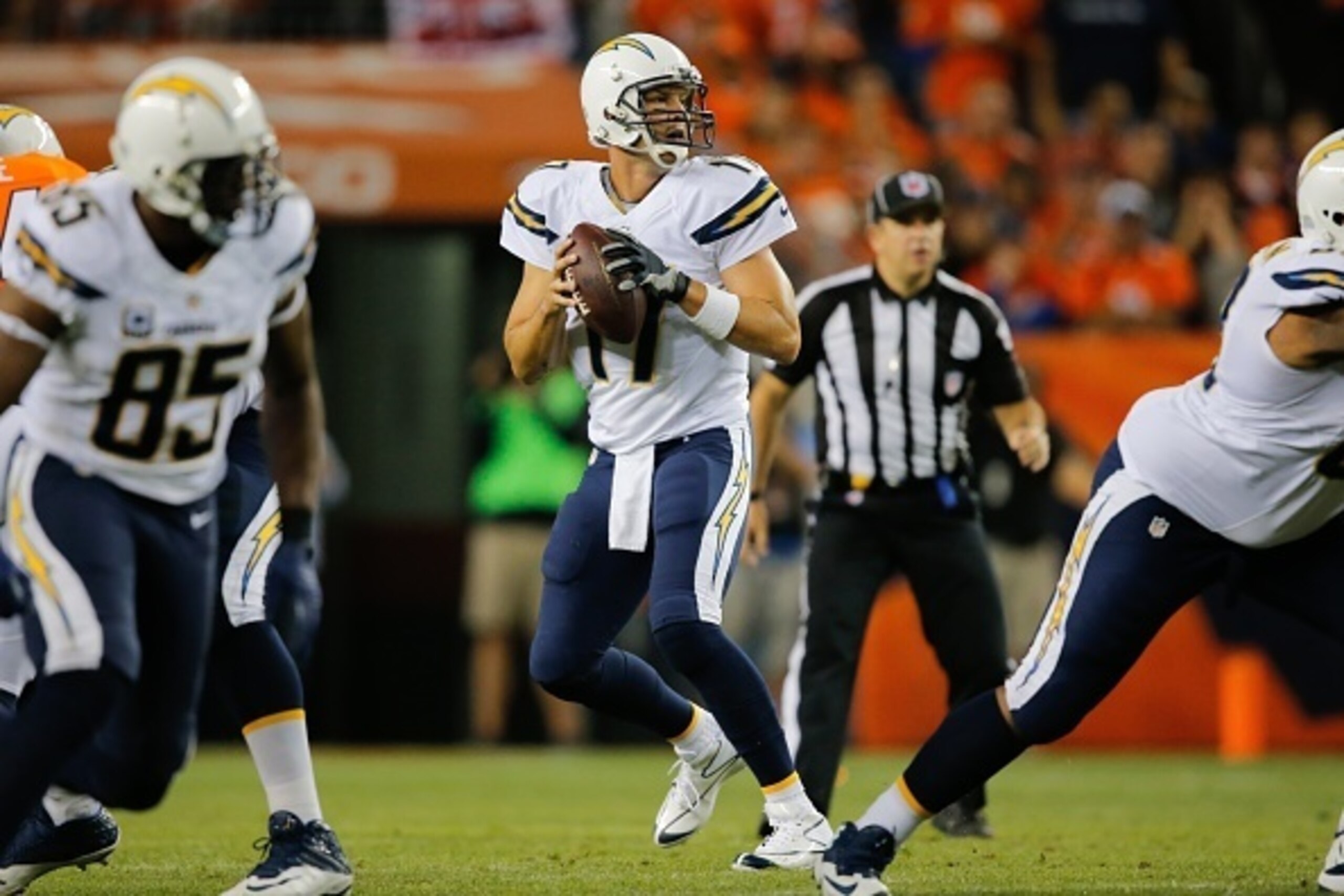 DENVER, CO - OCTOBER 23:  Quarterback Philip Rivers #17 of the San Diego Chargers drops back to pass against the Denver Broncos in the first quarter of a game at Sports Authority Field at Mile High on October 23, 2014 in Denver, Colorado.  (Photo by Doug 