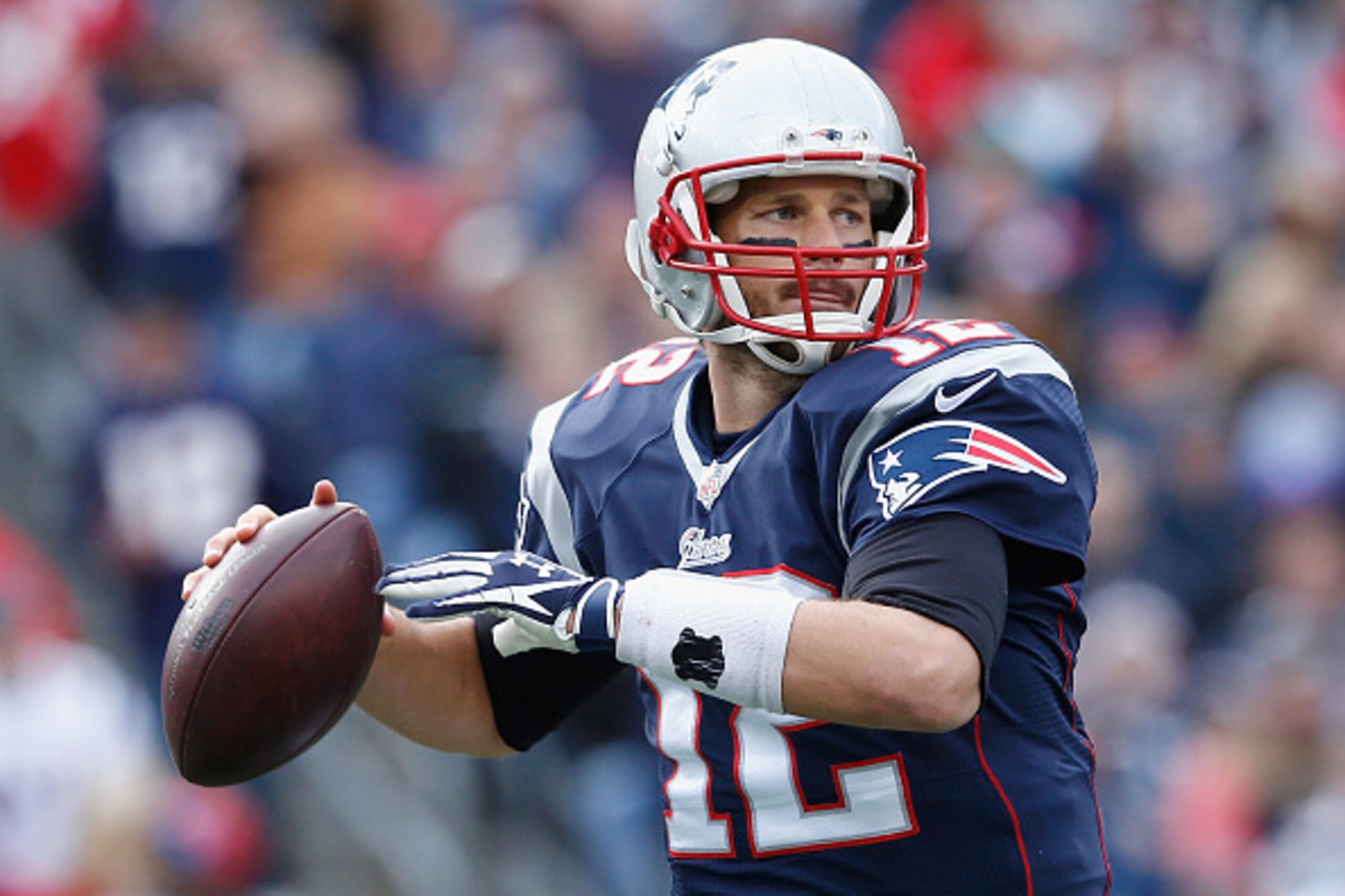 FOXBORO, MA - OCTOBER 26:  Tom Brady #12 of the New England Patriots passes the ball during the second quarter against the Chicago Bears at Gillette Stadium on October 26, 2014 in Foxboro, Massachusetts.  (Photo by Jim Rogash/Getty Images)