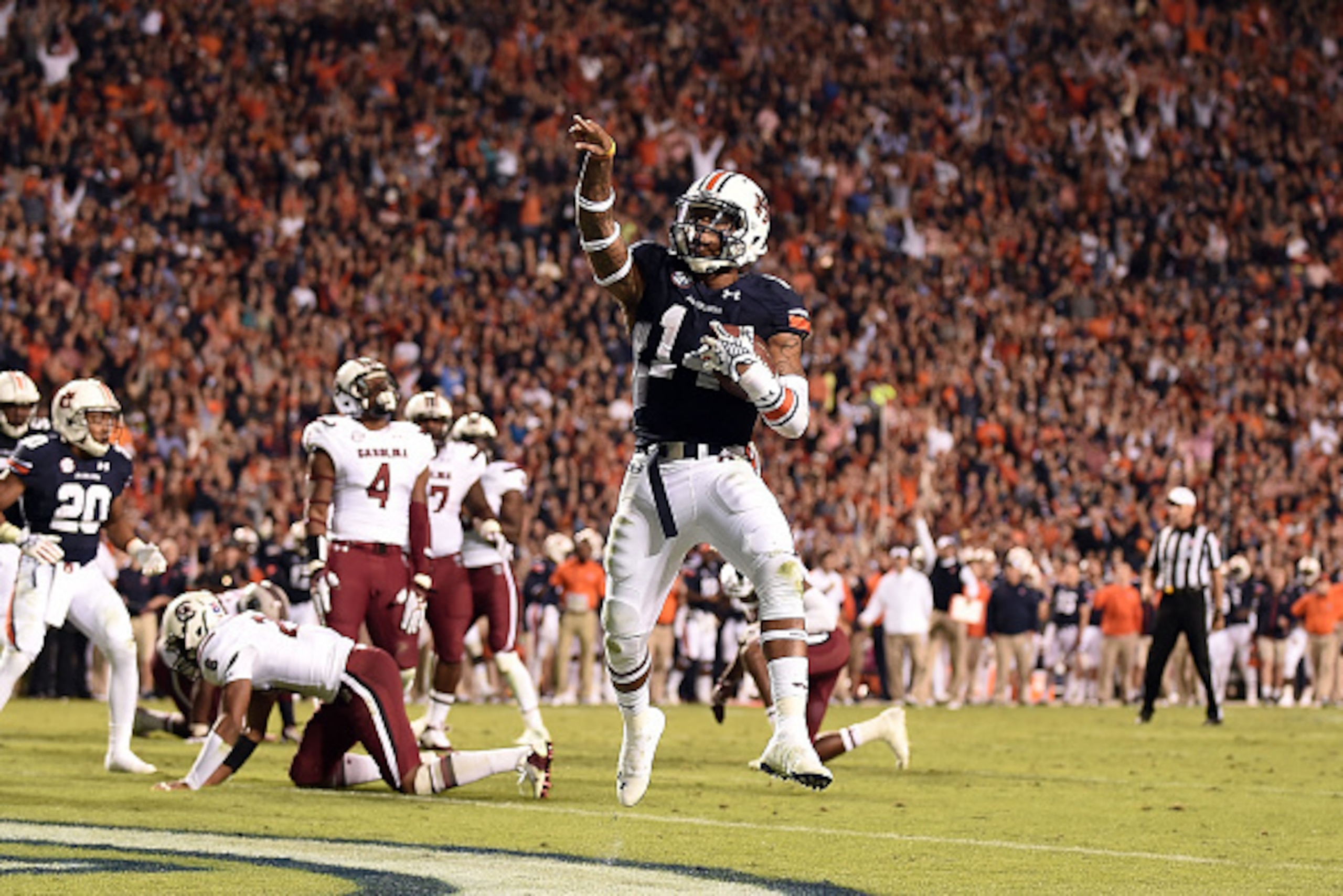 AUBURN, AL - OCTOBER 25:  Nick Marshall #14 of the Auburn Tigers scores a touchdown during the fourth quarter of a game against the South Carolina Gamecocks at Jordan Hare Stadium on October 25, 2014 in Auburn, Alabama.  (Photo by Stacy Revere/Getty Image