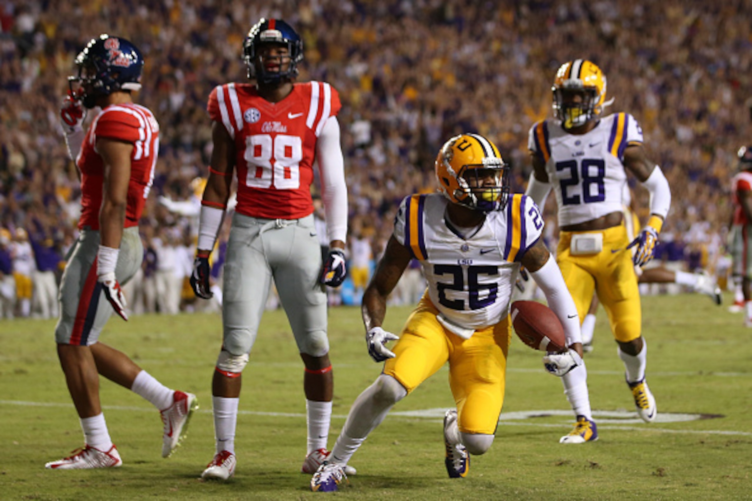 BATON ROUGE, LA - OCTOBER 25:  Ronald Martin #26 of the LSU Tigers recovers a ball against the Mississippi Rebels at Tiger Stadium on October 25, 2014 in Baton Rouge, Louisiana.  (Photo by Chris Graythen/Getty Images)