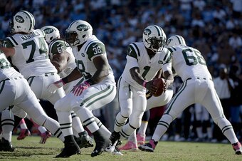 SAN DIEGO - OCTOBER 5:  Michael Vick #1 the New York Jets hands the ball off against the San Diego Chargers during their NFL game at Qualcomm Stadium on October 5, 2014 in San Diego, California. Chargers won the game 31-0. (Photo by Donald Miralle/Getty I