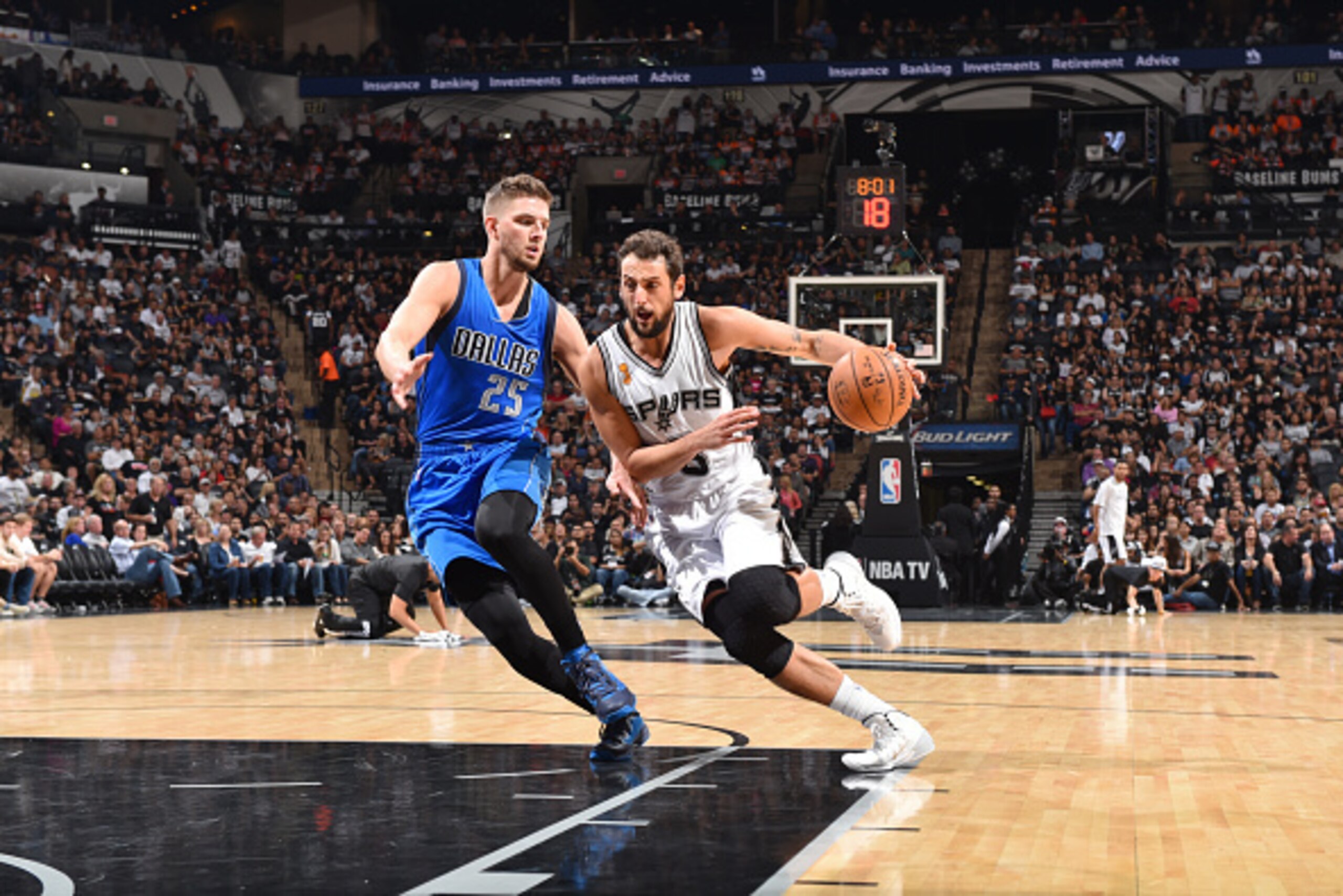 SAN ANTONIO, TX - OCTOBER 28: Marco Belinelli #3 of the San Antonio Spurs drives to the basket against Chandler Parsons #25 of the Dallas Mavericks during the game on October 22, 2014 at the AT&T Center in San Antonio,Texas. NOTE TO USER: User expressly a SAN ANTONIO, TX - OCTOBER 28: Marco Belinelli #3 of the San Antonio Spurs drives to the basket against Chandler Parsons #25 of the Dallas Mavericks during the game on October 22, 2014 at the AT&T Center in San Antonio,Texas. NOTE TO USER: User expressly a
