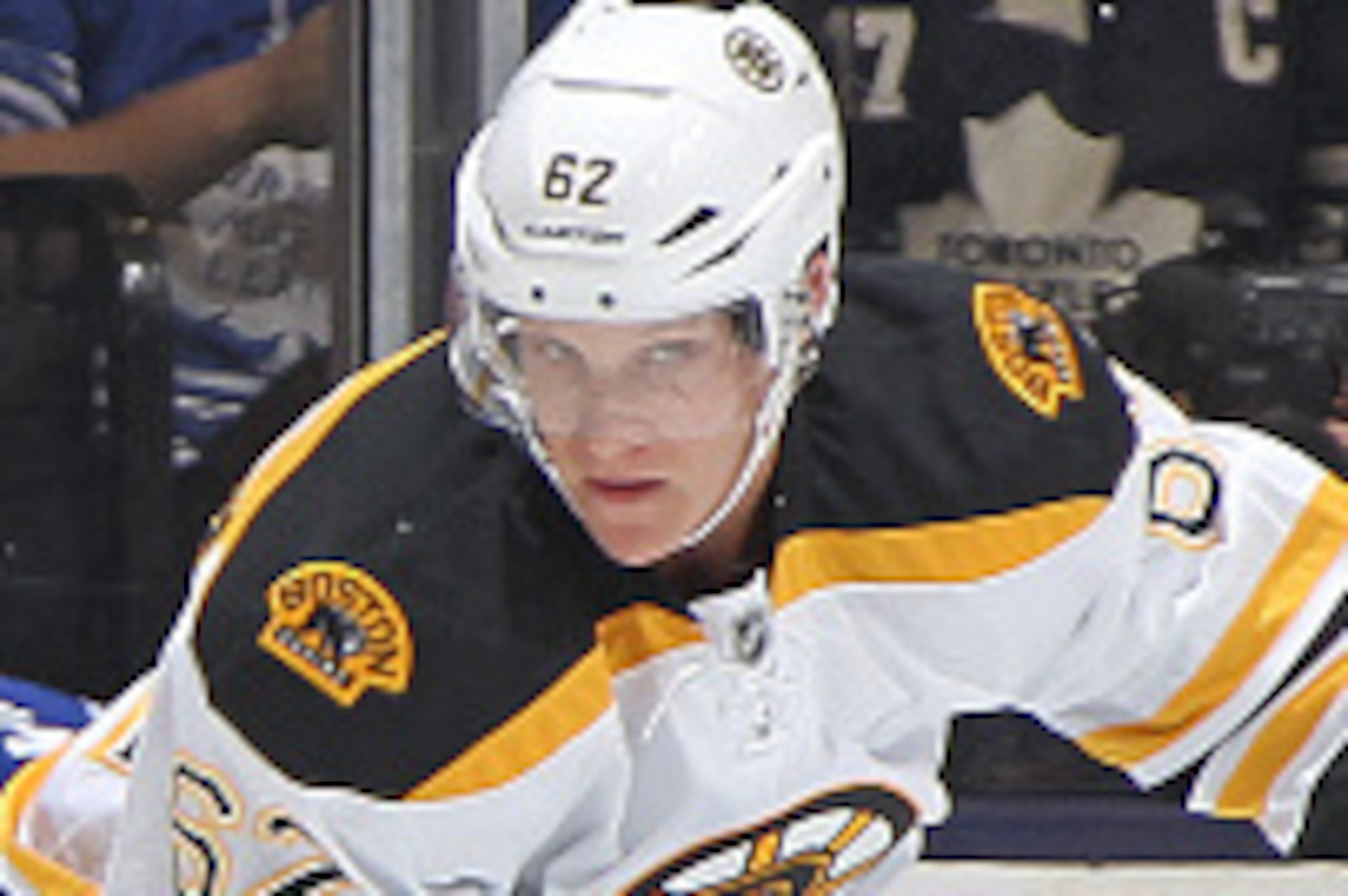 TORONTO, ON - OCTOBER 25:  Zach Trotman #62 of the Boston Bruins skates against Daniel Winnik #26 of the Toronto Maple Leafs in an NHL game at the Air Canada Centre on October 25, 2014 in Toronto, Ontario, Canada. (Photo by Claus Andersen/Getty Images)