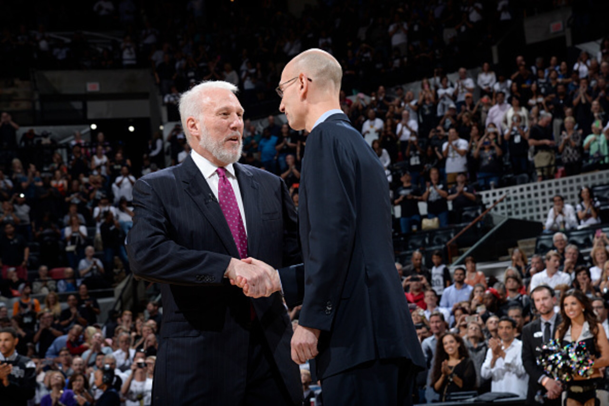 SAN ANTONIO, TX - OCTOBER 28: Greg Popovich the San Antonio Spurs receives his Championship Ring from Owner Peter Holt prior to the game against the Dallas Mavericks at the AT&T Center on October 28, 2014 in San Antonio, Texas. NOTE TO USER: User expre SAN ANTONIO, TX - OCTOBER 28: Greg Popovich the San Antonio Spurs receives his Championship Ring from Owner Peter Holt prior to the game against the Dallas Mavericks at the AT&T Center on October 28, 2014 in San Antonio, Texas. NOTE TO USER: User expre
