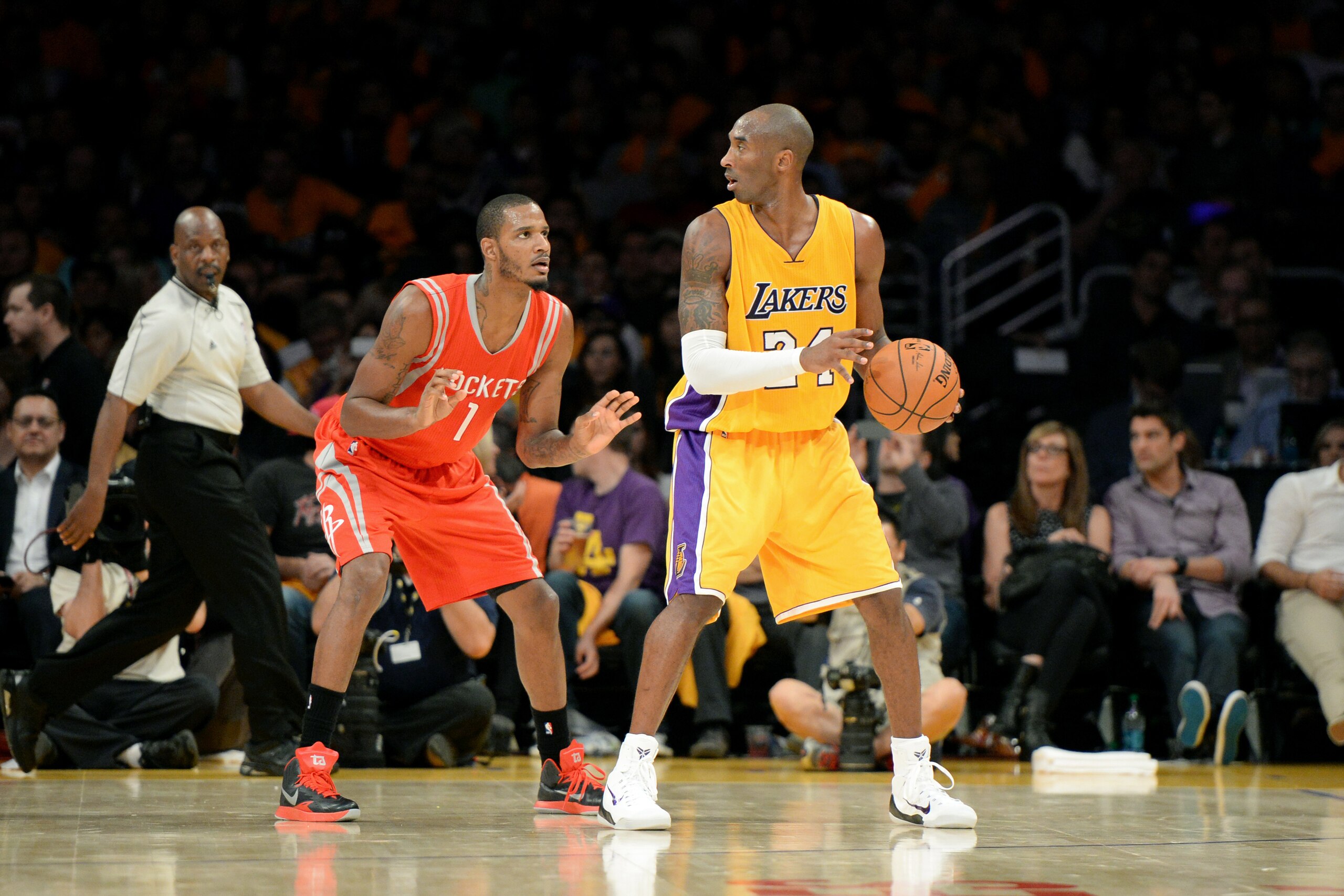 LOS ANGELES, CA - OCTOBER 28: Kobe Bryant #24 of the Los Angeles Lakers handles the ball against Trevor Ariza #1 of the Houston Rockets on October 28, 2014 at the Staples Center in Los Angeles, California. NOTE TO USER: User expressly acknowledges and agr
