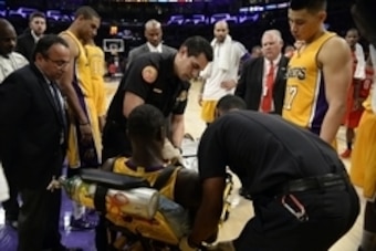 Oct 28, 2014; Los Angeles, CA, USA; Los Angeles Lakers forward Julius Randle (30) is tended to after an injury during the second half against the Houston Rockets at Staples Center. Mandatory Credit: Richard Mackson-USA TODAY Sports