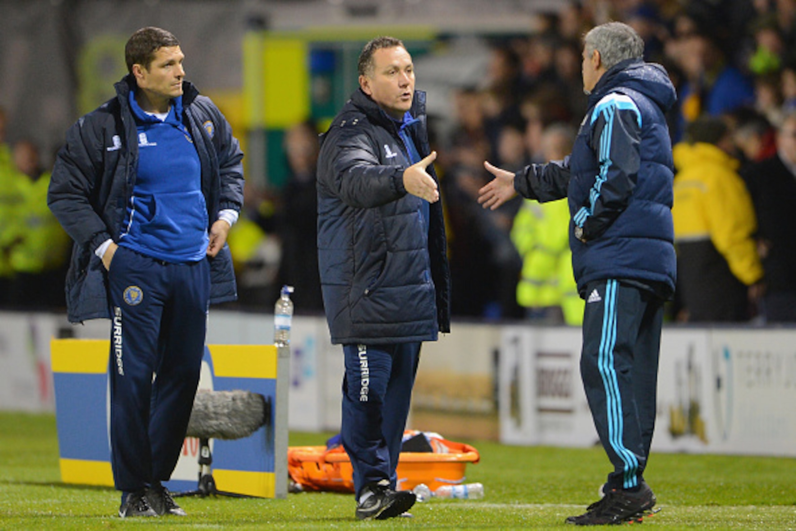 SHREWSBURY, ENGLAND - OCTOBER 28: Manager Micky Mellon of Shrewsbury Town (C) shakes hands with Jose Mourinho manager of Chelsea at the end of the match during the Capital One Cup Fourth Round match between Shrewsbury Town and Chelsea at Greenhous Meadow SHREWSBURY, ENGLAND - OCTOBER 28: Manager Micky Mellon of Shrewsbury Town (C) shakes hands with Jose Mourinho manager of Chelsea at the end of the match during the Capital One Cup Fourth Round match between Shrewsbury Town and Chelsea at Greenhous Meadow