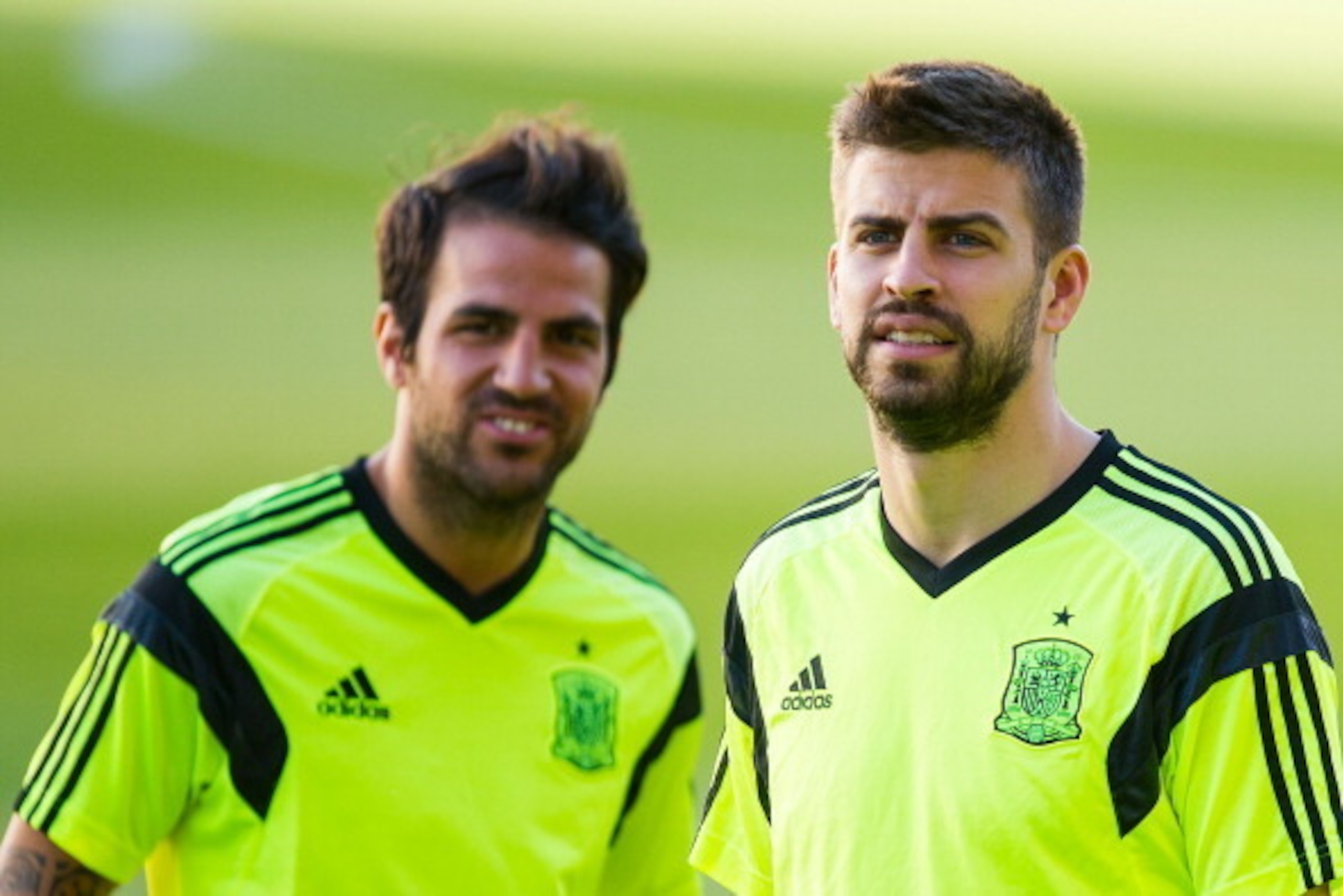 SEVILLE, SPAIN - MAY 29: Cesc Fabregas (L) and Gerard Pique of Spain look on during a training session ahead of their international friendly match against Bolivia at the Ramon Sanchez Pizjuan stadium on May 29, 2014 in Seville, Spain. (Photo by David Ra SEVILLE, SPAIN - MAY 29: Cesc Fabregas (L) and Gerard Pique of Spain look on during a training session ahead of their international friendly match against Bolivia at the Ramon Sanchez Pizjuan stadium on May 29, 2014 in Seville, Spain. (Photo by David Ra