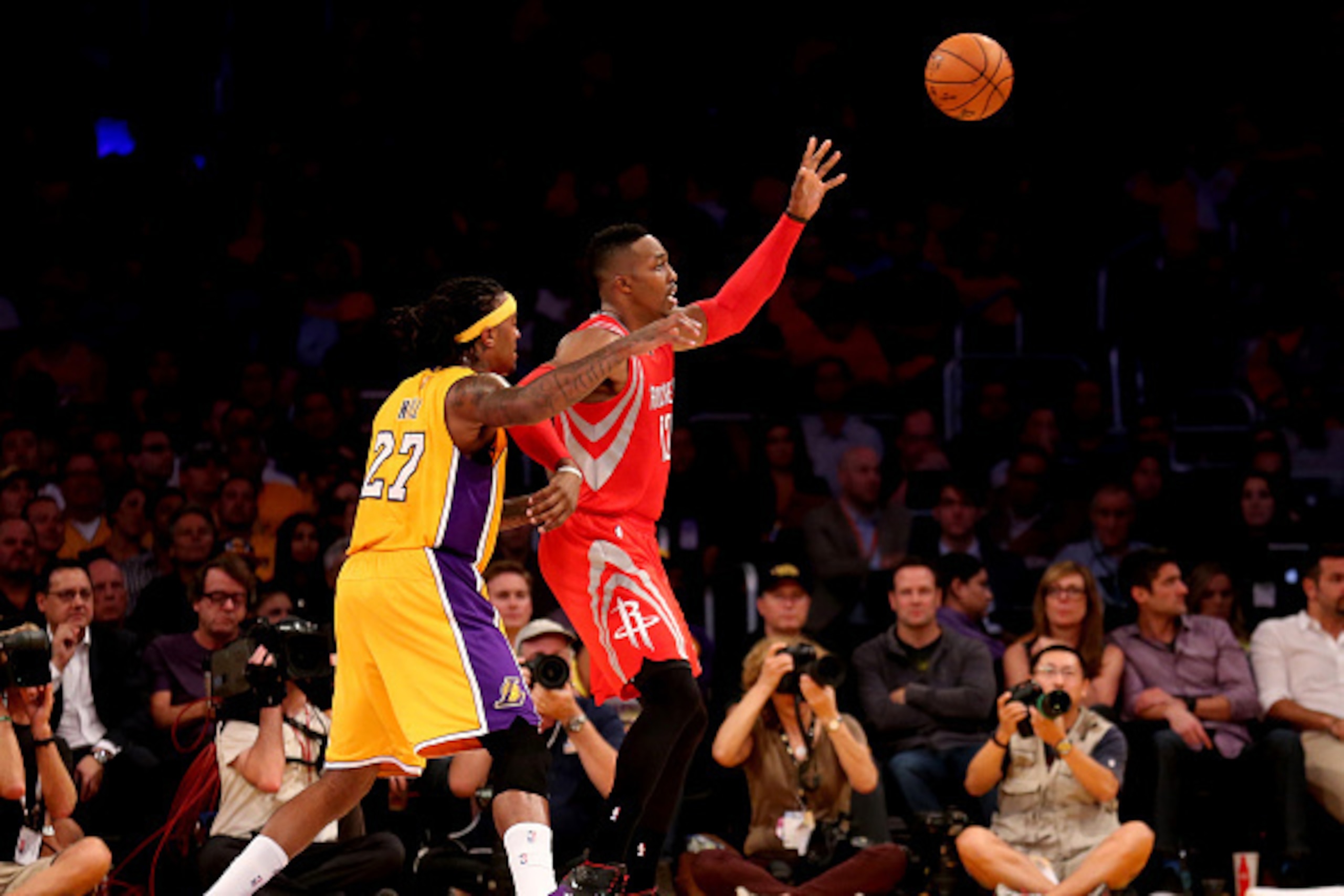 LOS ANGELES, CA - OCTOBER 28: Dwight Howard #12 of the Houston Rockets catches a pass in front of Jordan Hill #27 of the Los Angeles Lakers at Staples Center on October 28, 2014 in Los Angeles, California. NOTE TO USER: User expressly acknowledges and a LOS ANGELES, CA - OCTOBER 28: Dwight Howard #12 of the Houston Rockets catches a pass in front of Jordan Hill #27 of the Los Angeles Lakers at Staples Center on October 28, 2014 in Los Angeles, California. NOTE TO USER: User expressly acknowledges and a