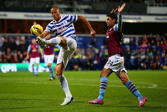 LONDON, ENGLAND - OCTOBER 27:  Bobby Zamora of QPR is marshalled by Matthew Lowton of Aston Villa during the Barclays Premier League match between Queens Park Rangers and Aston Villa at Loftus Road on October 27, 2014 in London, England.  (Photo by Ian Wa