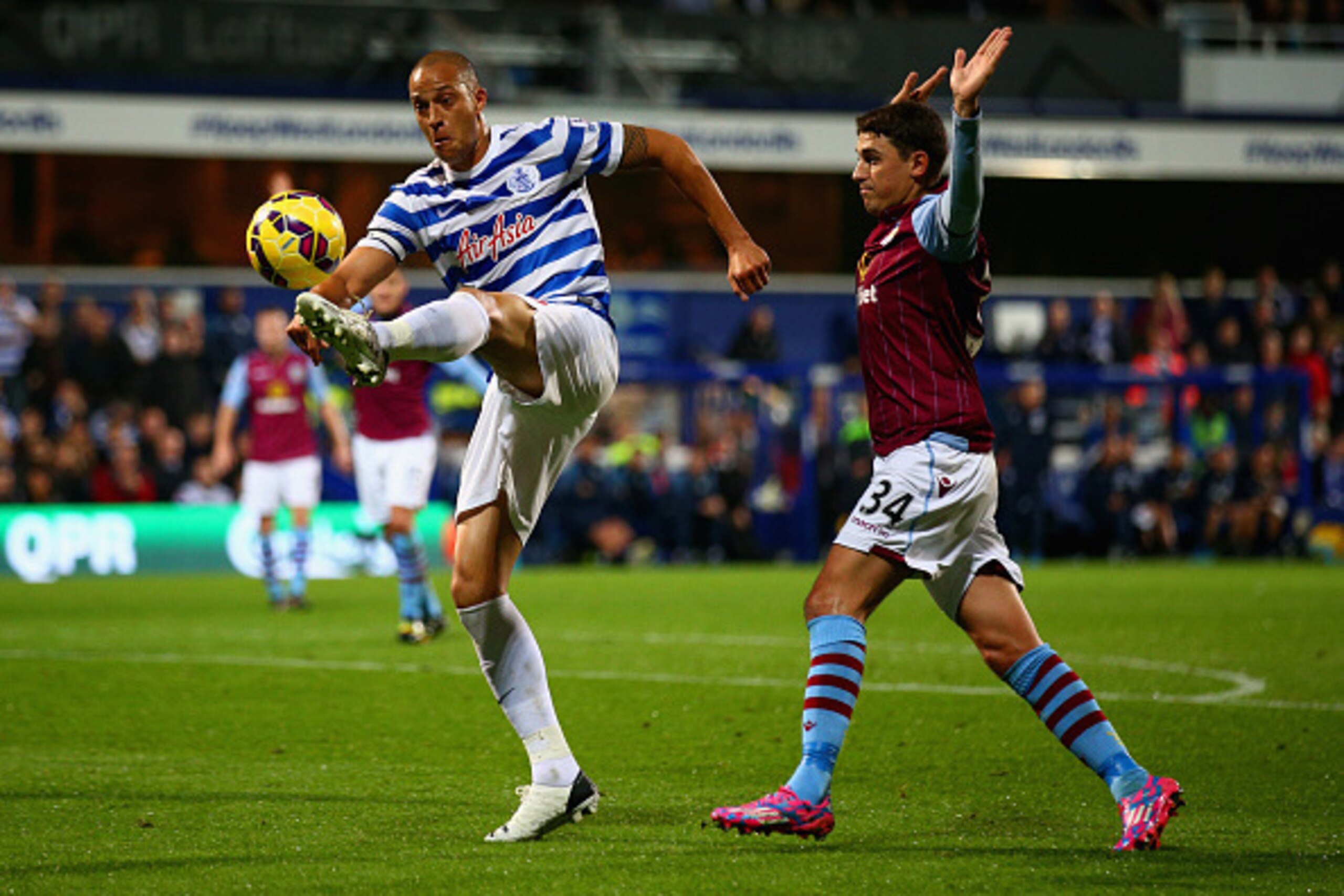 LONDON, ENGLAND - OCTOBER 27:  Bobby Zamora of QPR is marshalled by Matthew Lowton of Aston Villa during the Barclays Premier League match between Queens Park Rangers and Aston Villa at Loftus Road on October 27, 2014 in London, England.  (Photo by Ian Wa