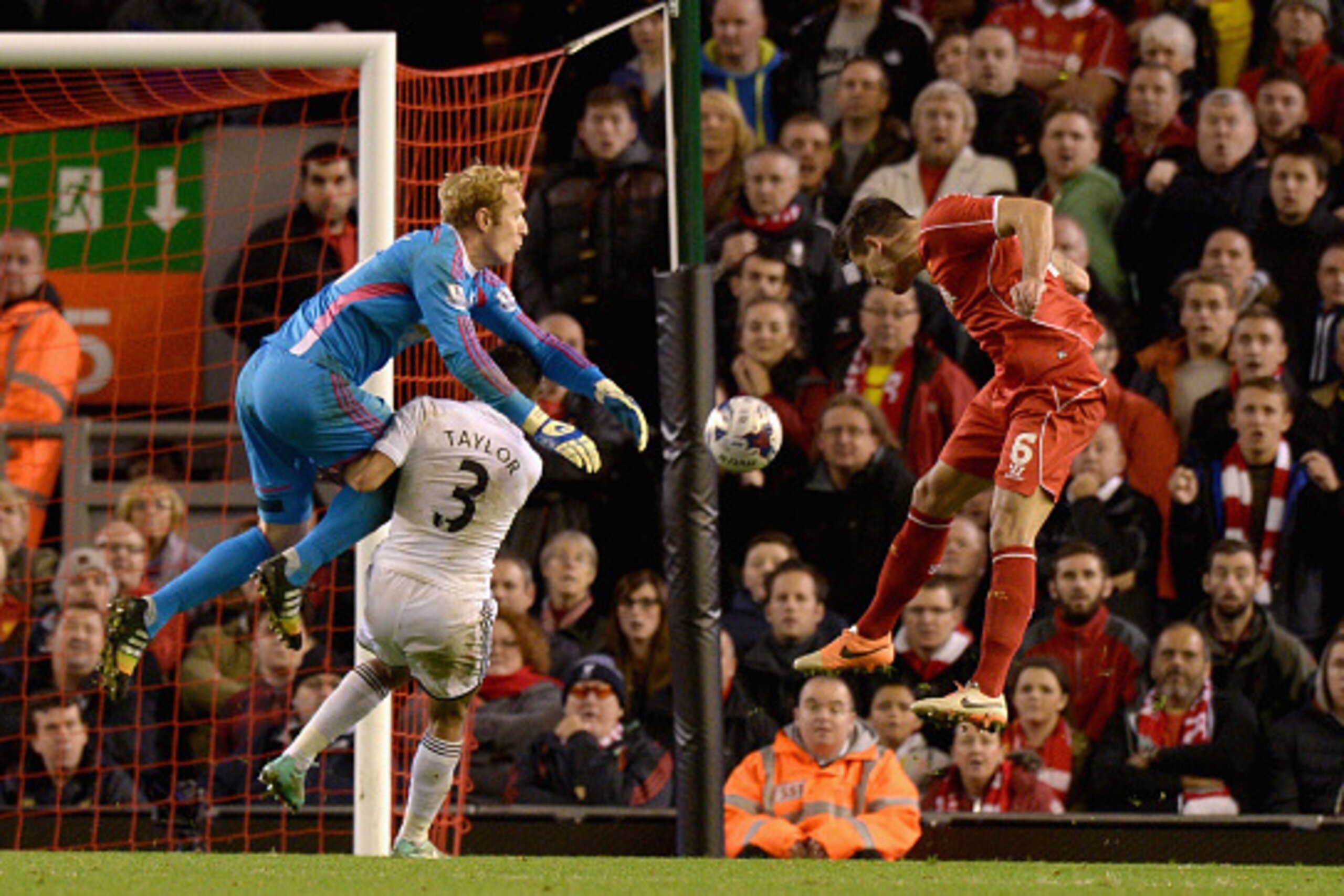 LIVERPOOL, ENGLAND - OCTOBER 28:  Dejan Lovren of Liverpool scores the winning goal past Gerhard Tremmel of Swansea during the Capital One Cup Fourth Round match between Liverpool and Swansea City at Anfield on October 28, 2014 in Liverpool, England.  (Ph