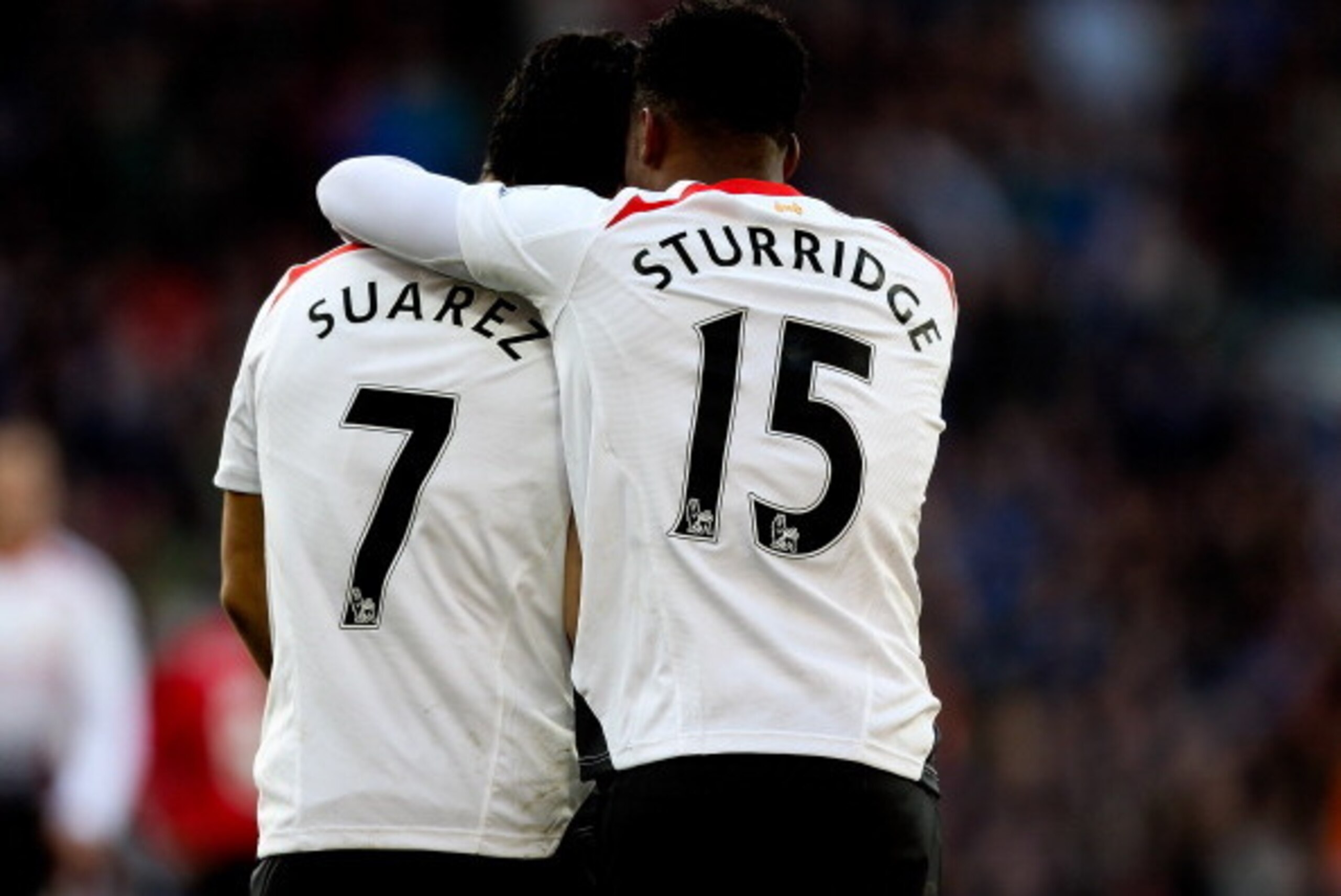 CARDIFF, WALES - MARCH 22:  Daniel Sturridge of Liverpool celebrates with team mate Luis Suarez after scoring his team's fifth goal during the Barclays Premier League match between Cardiff City and Liverpool at Cardiff City Stadium on March 22, 2014 in Ca