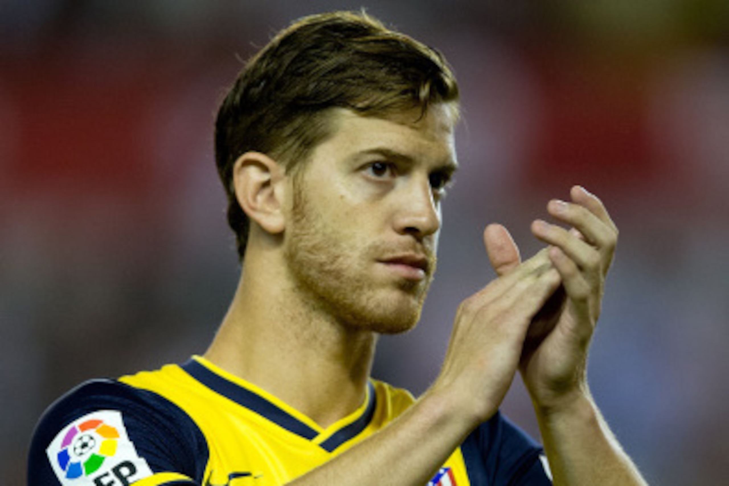 MADRID, SPAIN - AUGUST 25: Cristian Ansaldi of Atletico de Madrid claps prior to start the La Liga match between Rayo Vallecano de Madrid and Club Atletico de Madrid at Estadio de Vallecas on August 25, 2014 in Madrid, Spain.  (Photo by Gonzalo Arroyo Mor