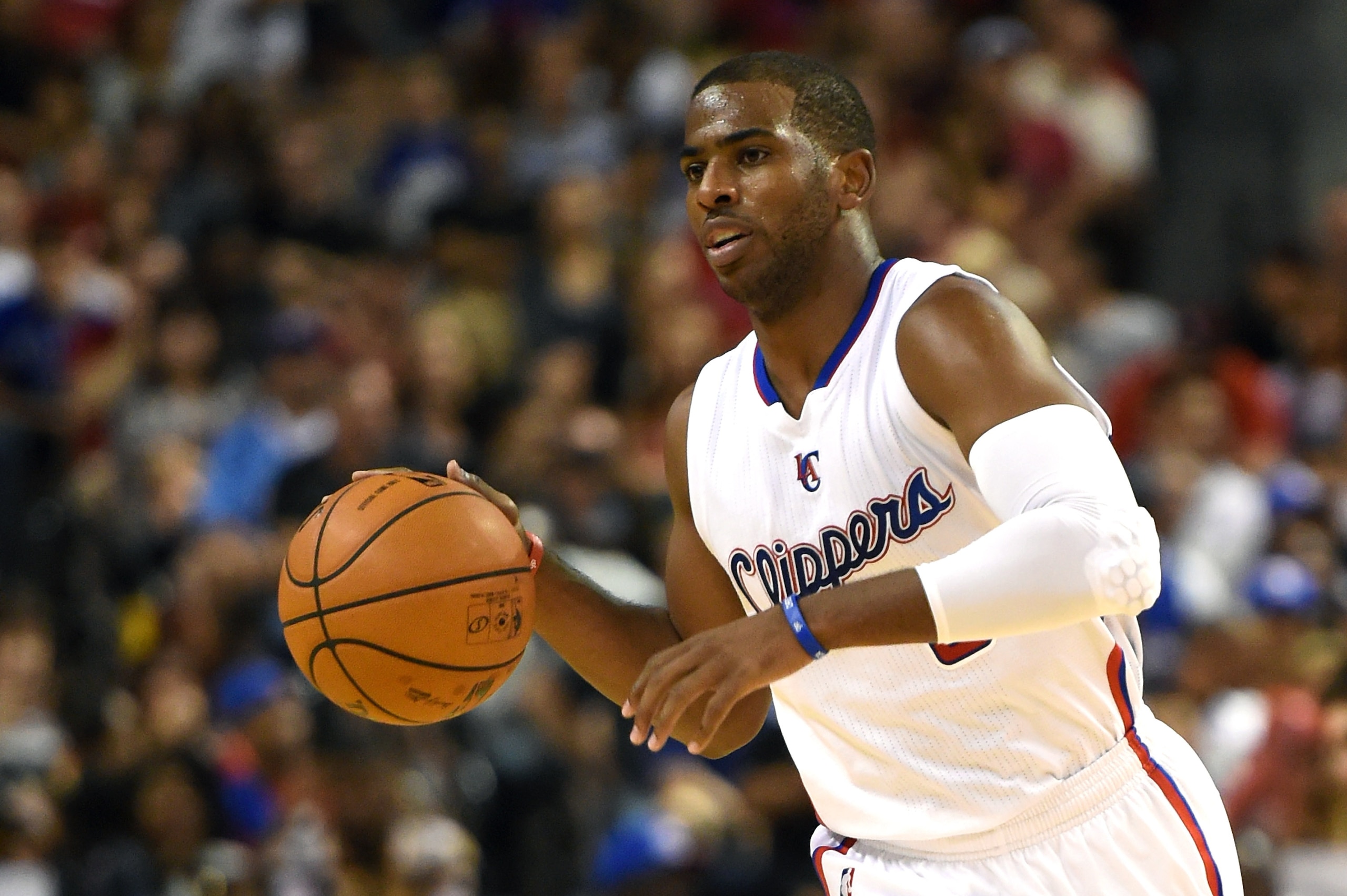 LAS VEGAS, NV - OCTOBER 18: Chris Paul #3 of the Los Angeles Clippers brings the ball up the court against the Denver Nuggets during their preseason game at the Mandalay Bay Events Center on October 18, 2014 in Las Vegas, Nevada. Denver won 104-93. NOTE LAS VEGAS, NV - OCTOBER 18: Chris Paul #3 of the Los Angeles Clippers brings the ball up the court against the Denver Nuggets during their preseason game at the Mandalay Bay Events Center on October 18, 2014 in Las Vegas, Nevada. Denver won 104-93. NOTE
