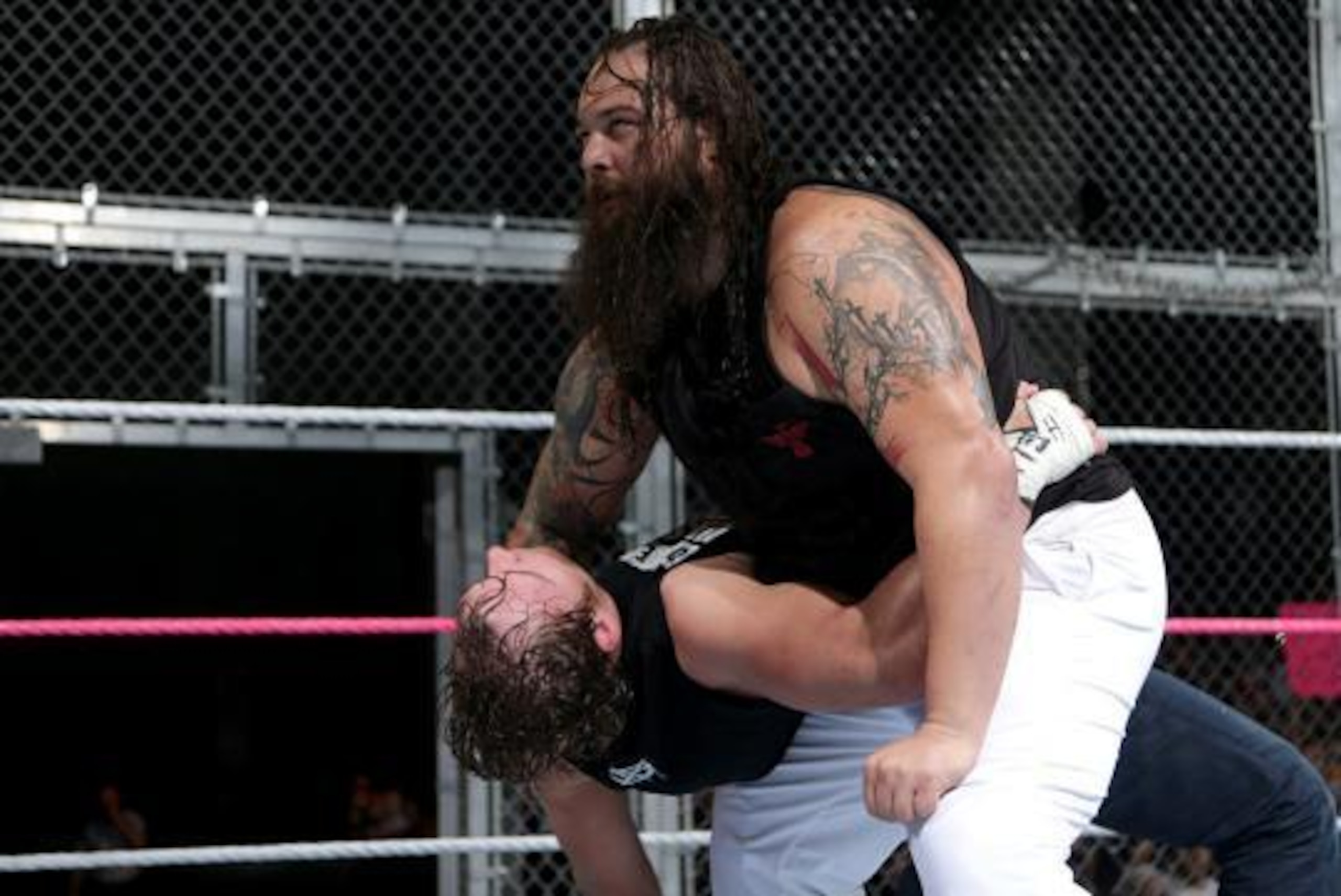 Bray Wyatt attacks Ambrose at Hell in a Cell.