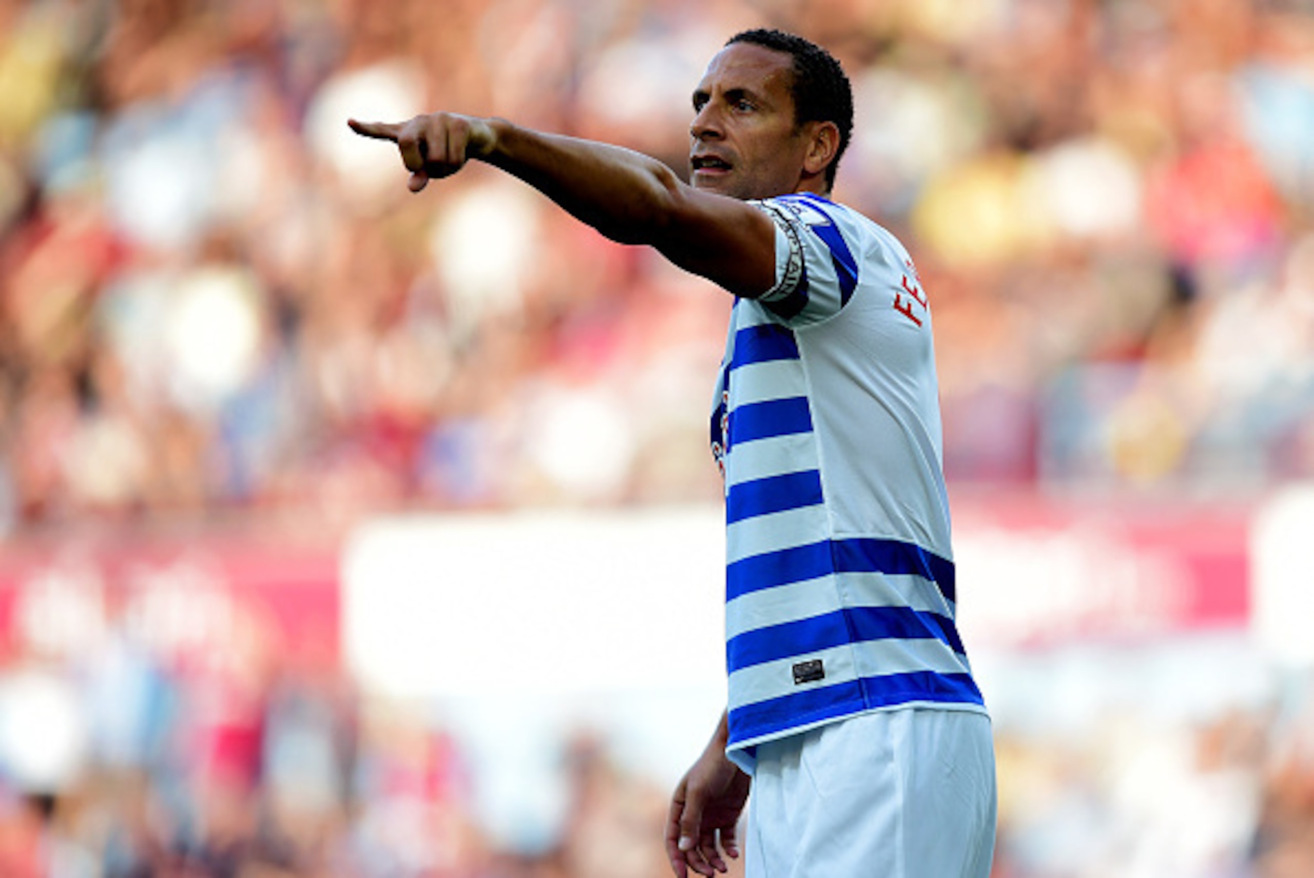 LONDON, ENGLAND - OCTOBER 05:  Rio Ferdinand of QPR signals during the Barclays Premier League match between West Ham United and Queens Park Rangers at Boleyn Ground on October 5, 2014 in London, England.  (Photo by Jamie McDonald/Getty Images)