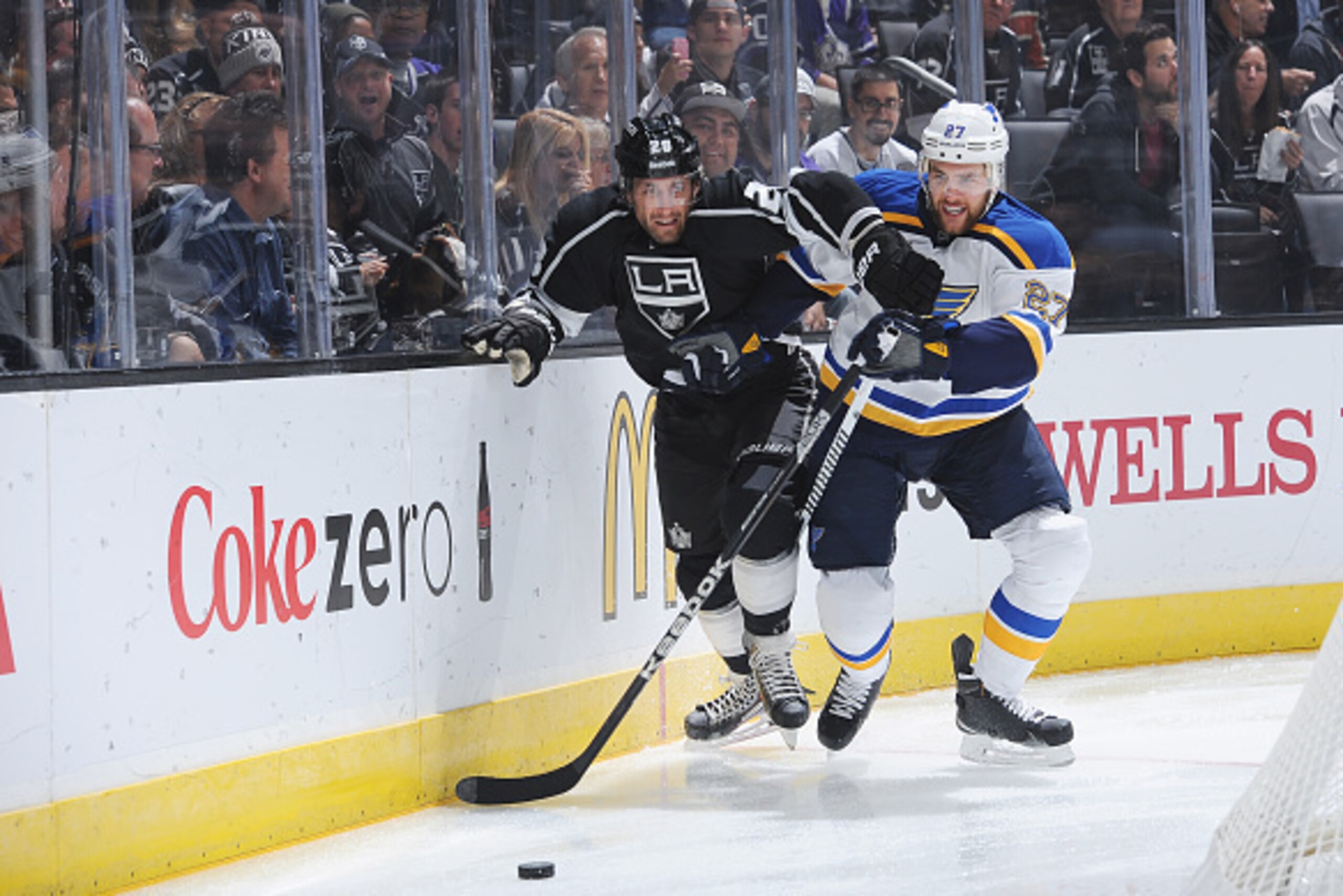 LOS ANGELES, CA - OCTOBER 16: Jarret Stoll #28 of the Los Angeles Kings fights for the puck against Alex Pietrangelo #27 of the St. Louis Blues at STAPLES Center on October 16, 2014 in Los Angeles, California. (Photo by Juan Ocampo/NHLI via Getty Images)