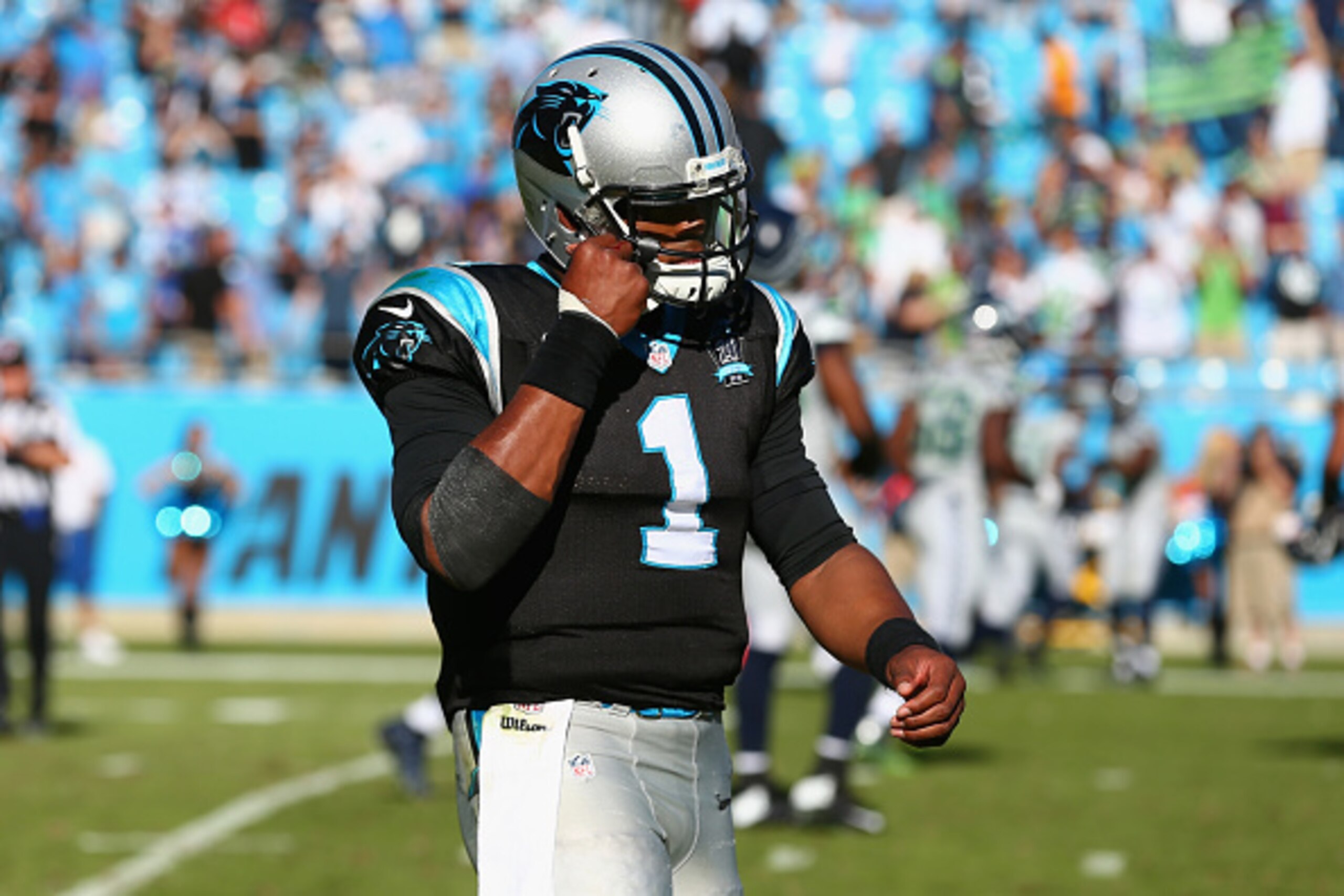 CHARLOTTE, NC - OCTOBER 26:  Cam Newton #1 of the Carolina Panthers leaves the field after losing 13-9 to the Seattle Seahawks at Bank of America Stadium on October 26, 2014 in Charlotte, North Carolina.  (Photo by Streeter Lecka/Getty Images)