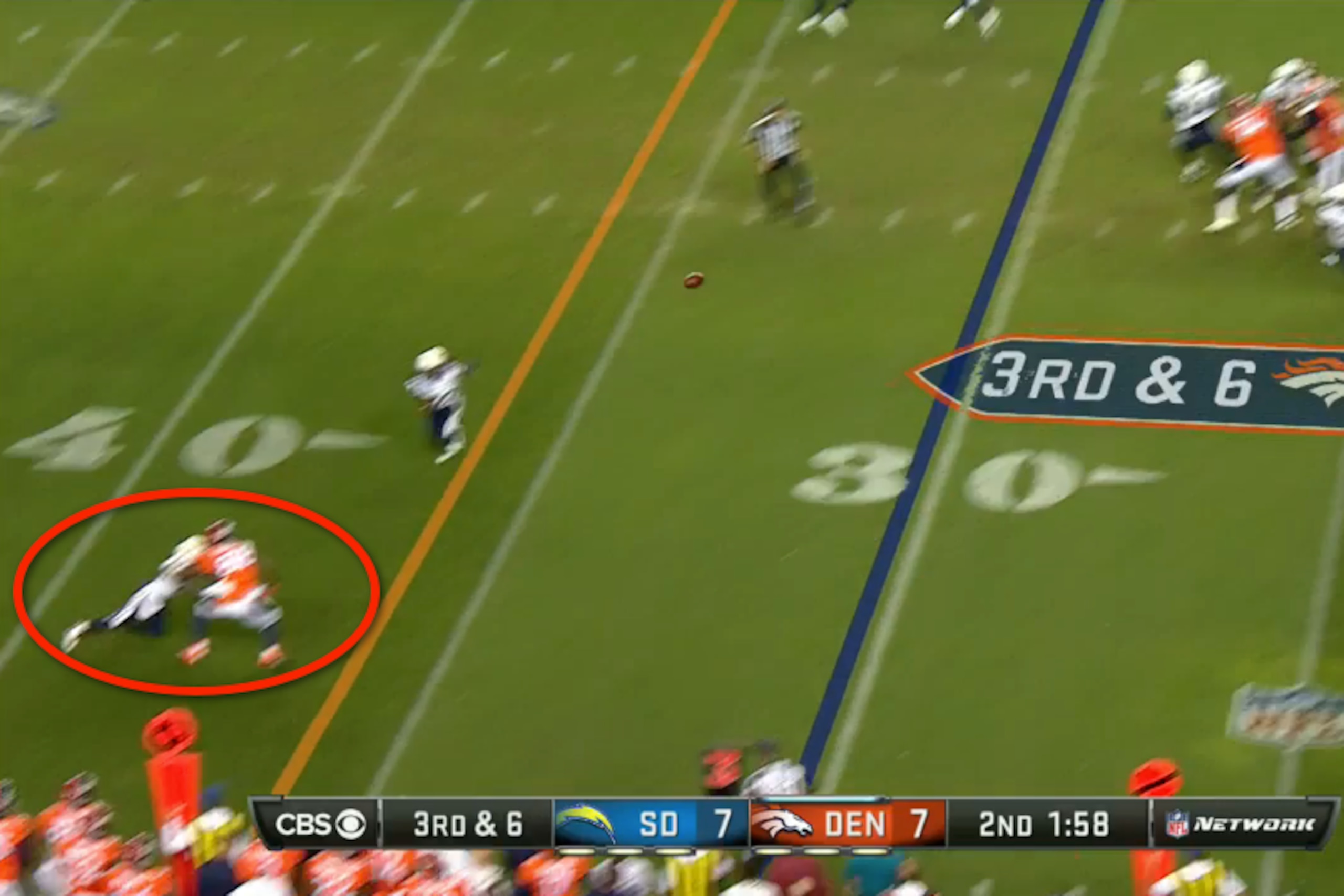 Shareece Wright caught tackling Thomas as the ball arrives.