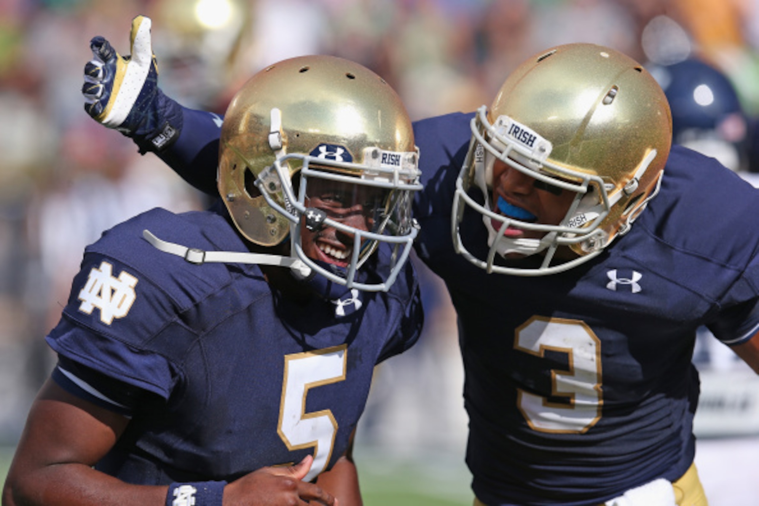 SOUTH BEND, IN - AUGUST 30:  Everett Golson #5 and Amir Carilisle #3 of the Norte Dame Fighting Irish celebrate Golson's second quarter touchdown against the Rice Owls at Notre Dame Stadium on August 30, 2014 in South Bend, Indiana.  (Photo by Jonathan Da