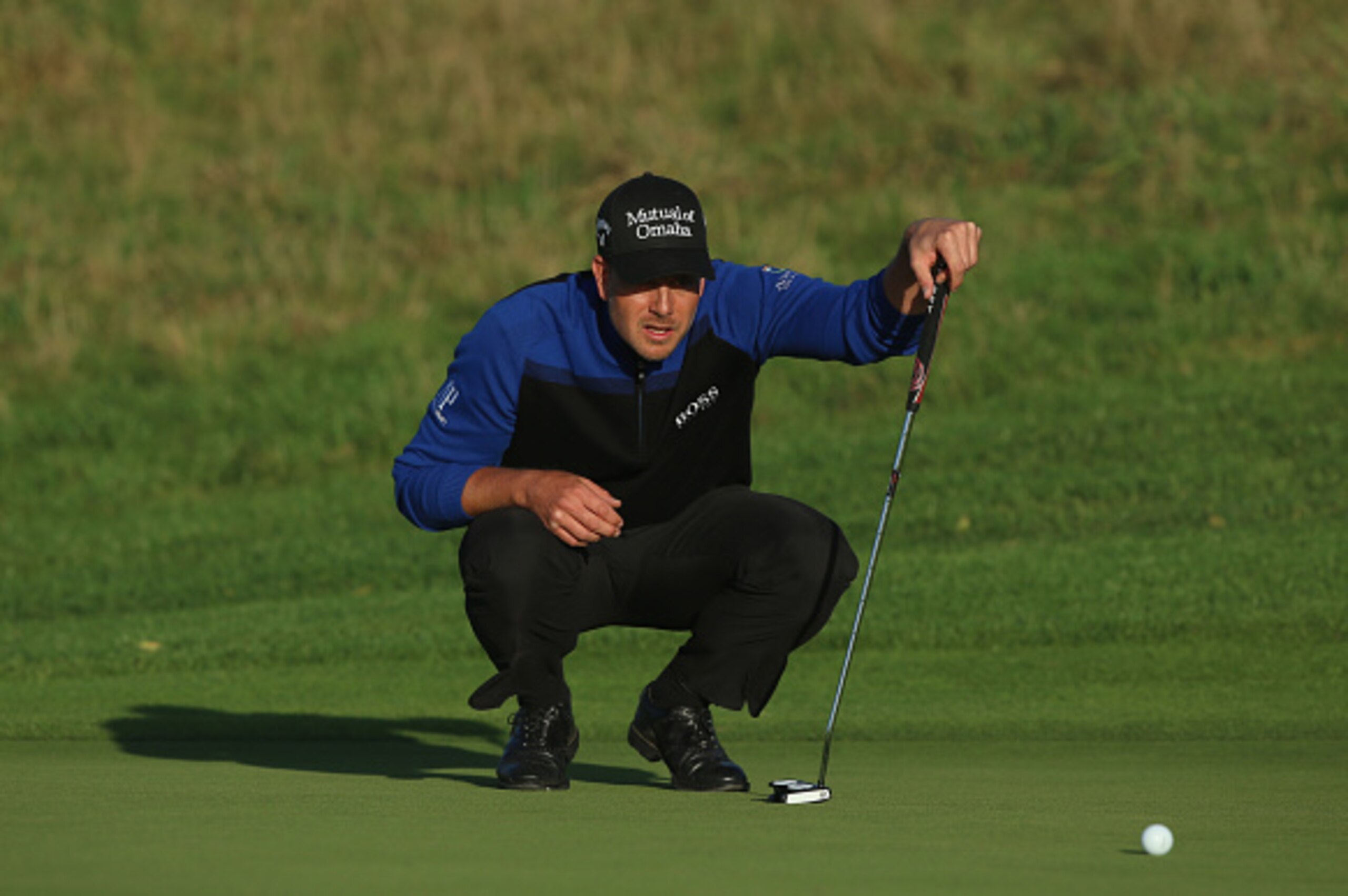 ASH, ENGLAND - OCTOBER 19:  Henrik Stenson of Sweden putts on the 16th hole during the final of the Volvo World Match Play Championship at The London Club on October 19, 2014 in Ash, United Kingdom.  (Photo by Andrew Redington/Getty Images)