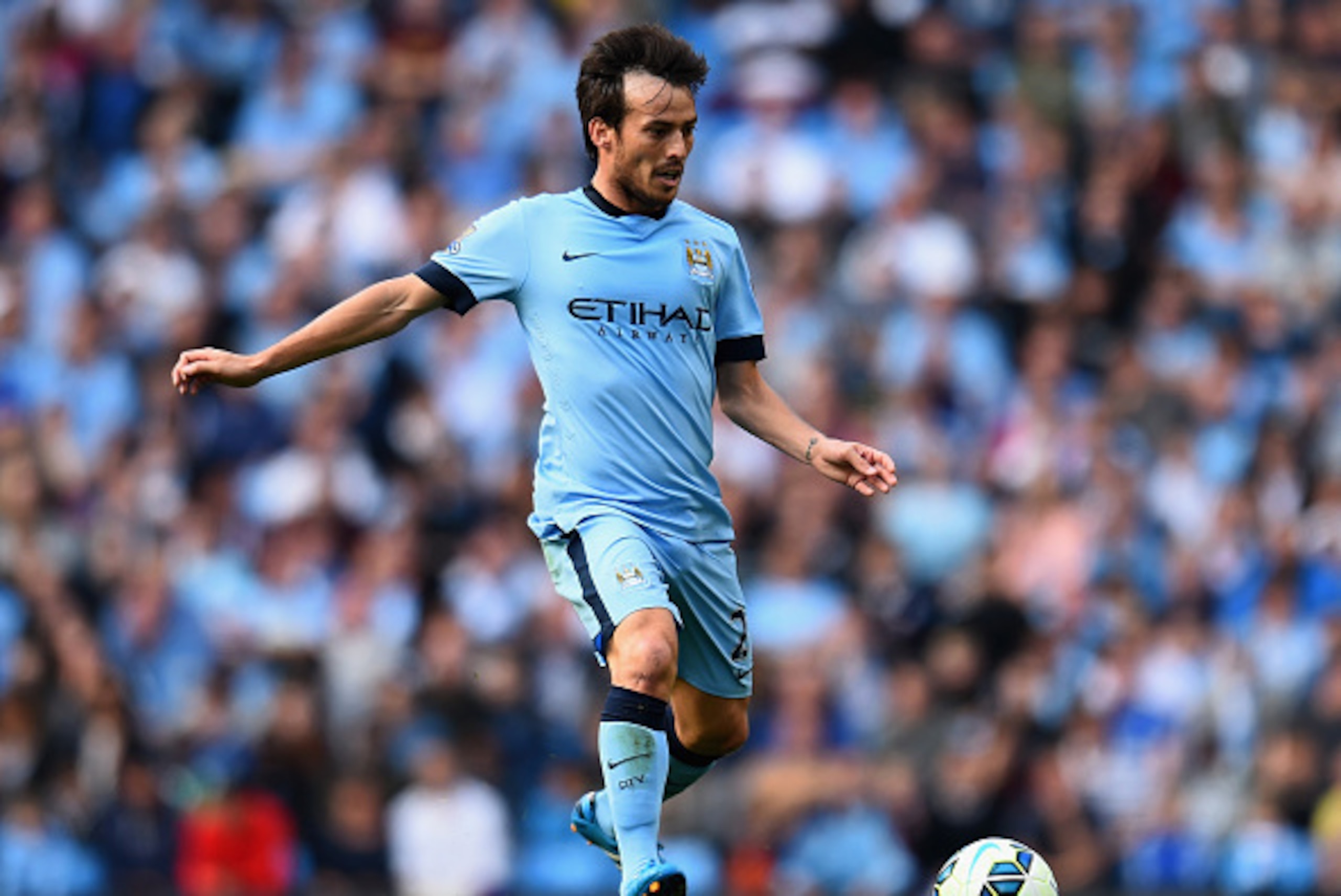 MANCHESTER, ENGLAND - SEPTEMBER 21:  David Silva of Manchester City in action during the Barclays Premier League match between Manchester City and Chelsea at the Etihad Stadium on September 21, 2014 in Manchester, England.  (Photo by Shaun Botterill/Getty