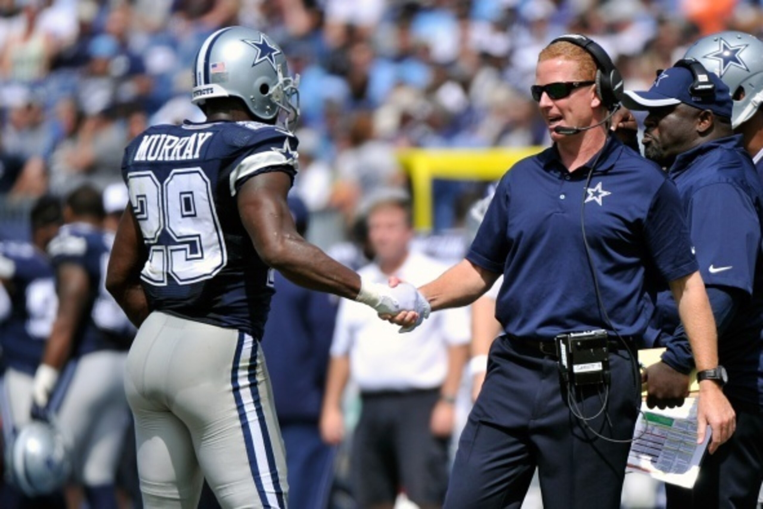 NASHVILLE, TN - SEPTEMBER 14:  Head coach Jason Garrett of the Dallas Cowboys shakes the hand of DeMarco Murray #29 after a touchdown against the Tennessee Titans in the first half of a game at LP Field on September 14, 2014 in Nashville, Tennessee.  (Pho