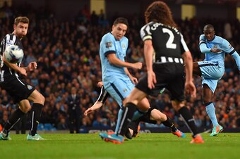 MANCHESTER, ENGLAND - OCTOBER 29: Yaya Toure of Manchester City shoots Referee Anthony Taylor goal during the Capital One Cup Fourth Round match between Manchester City and Newcastle United at Etihad Stadium on October 29, 2014 in Manchester, England.  (P